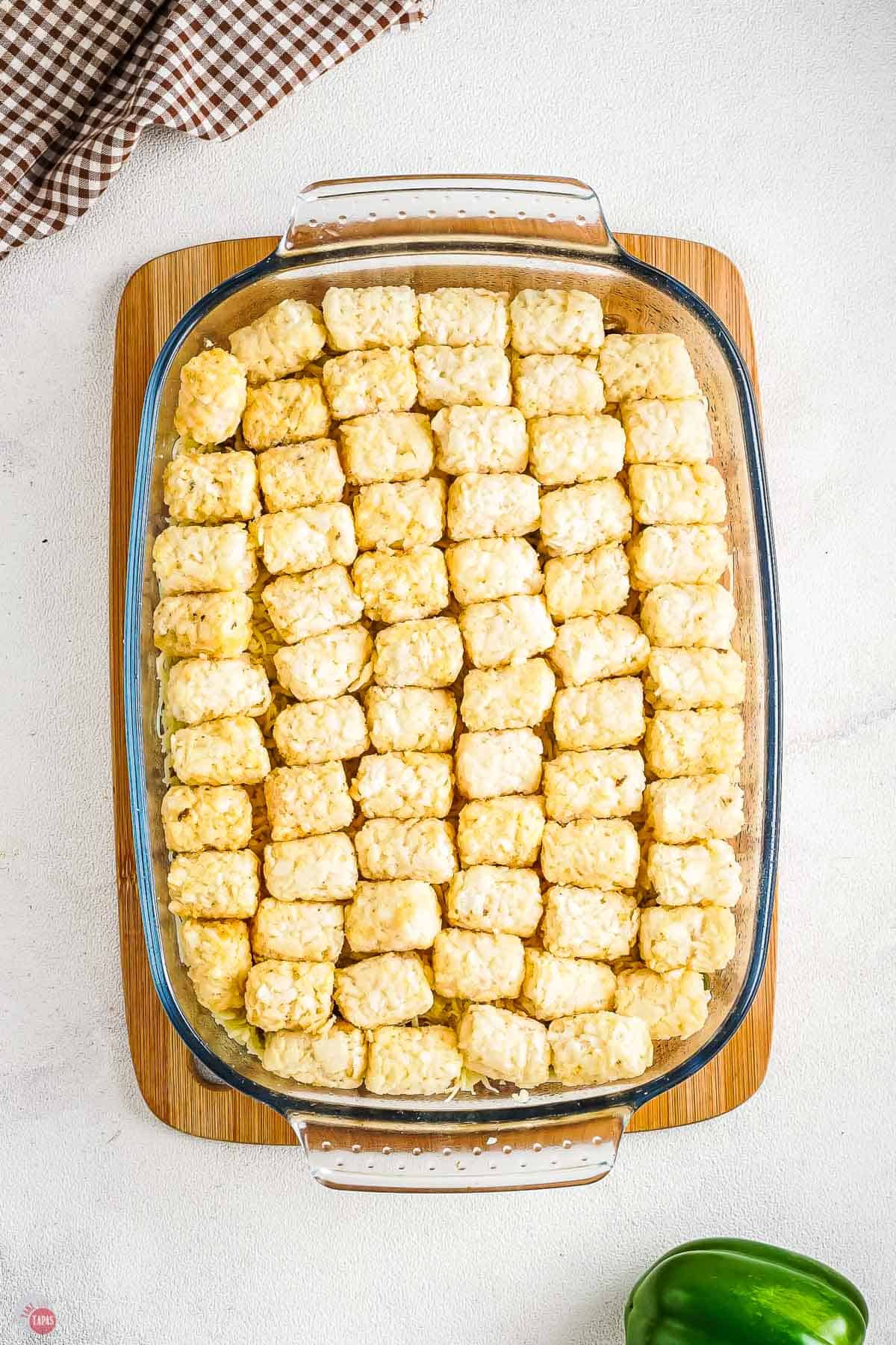 casserole dish filled with frozen tater tots