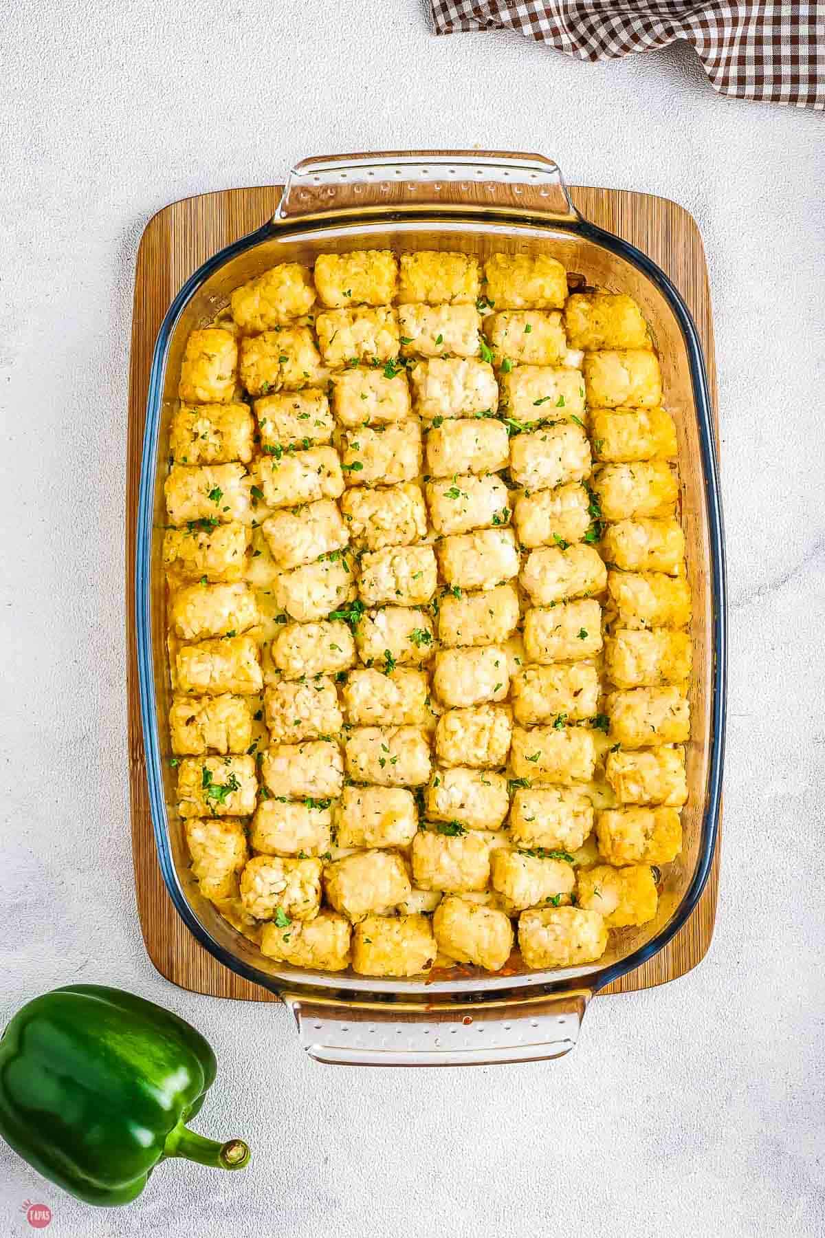 baking dish with cooked tater tot casserole in it