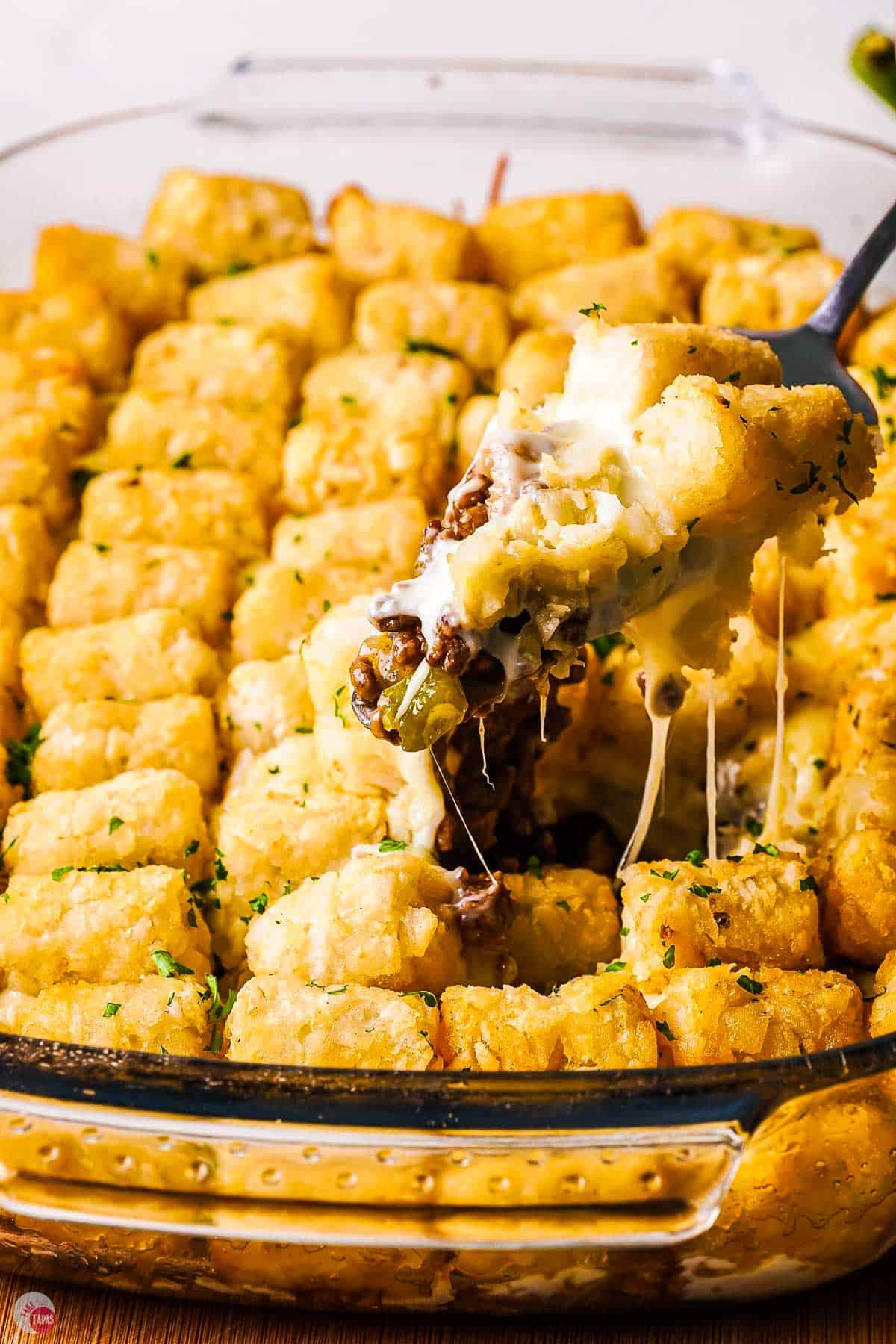 spatula scooping out some tater tot casserole