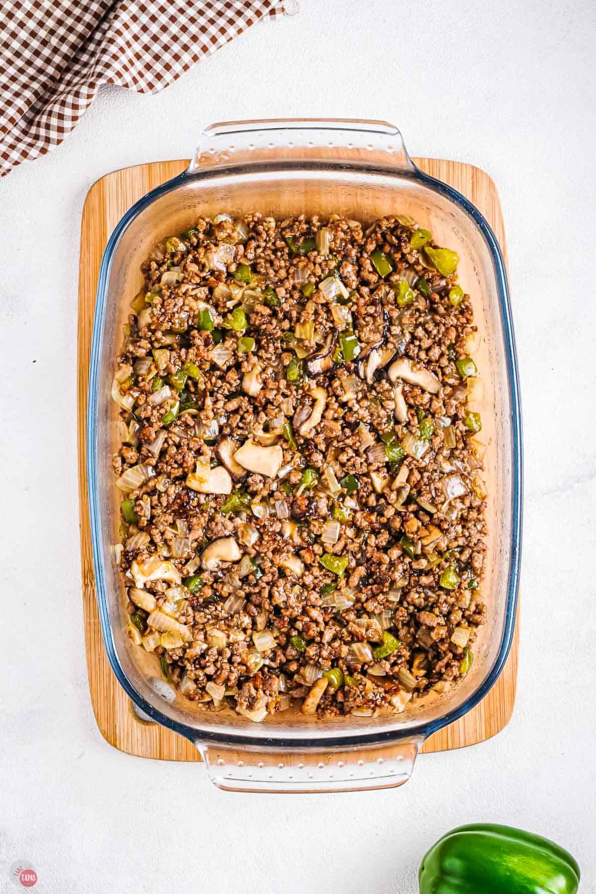 philly cheesesteak filling in a casserole dish