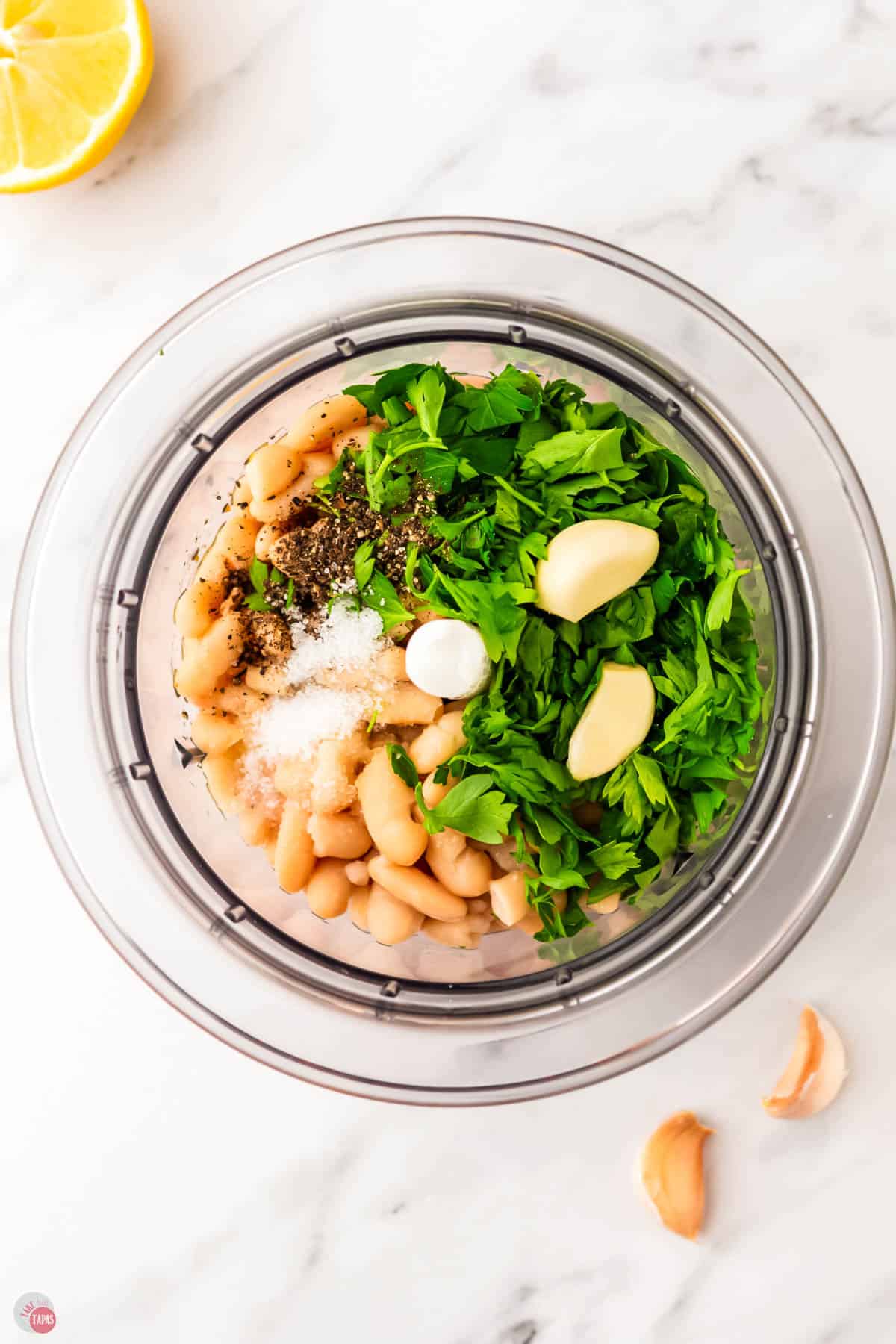 white beans, garlic, and parsley in a food processor