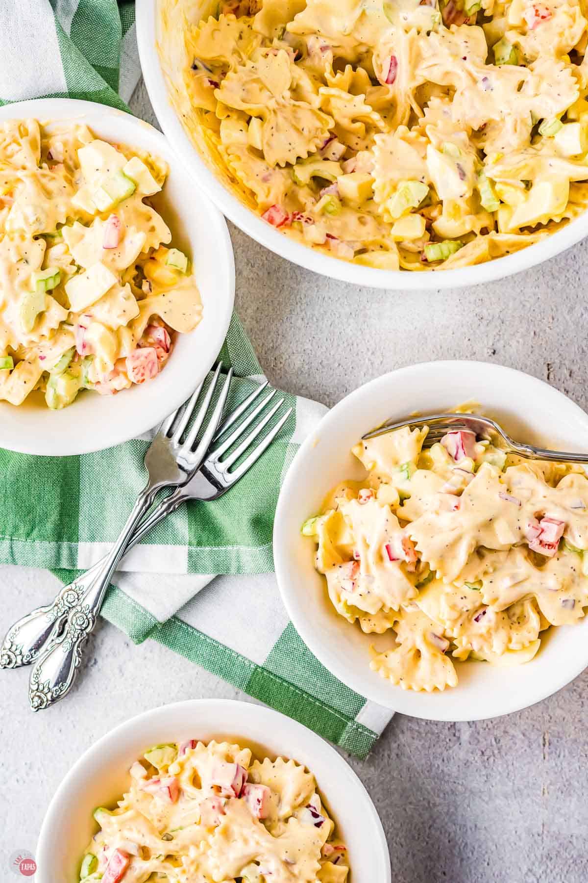 three bowls of pasta salad