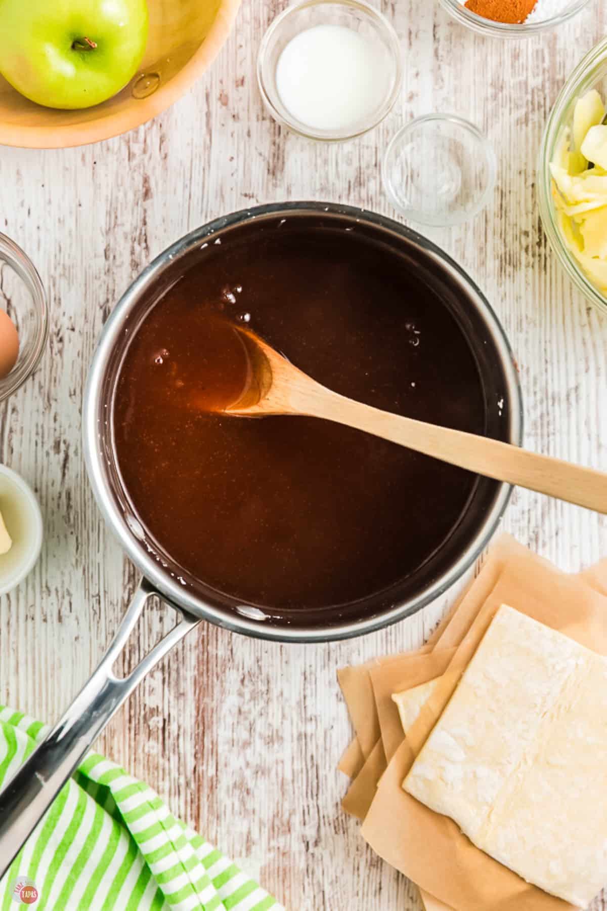 sauce pan with sugar and water boiling in it