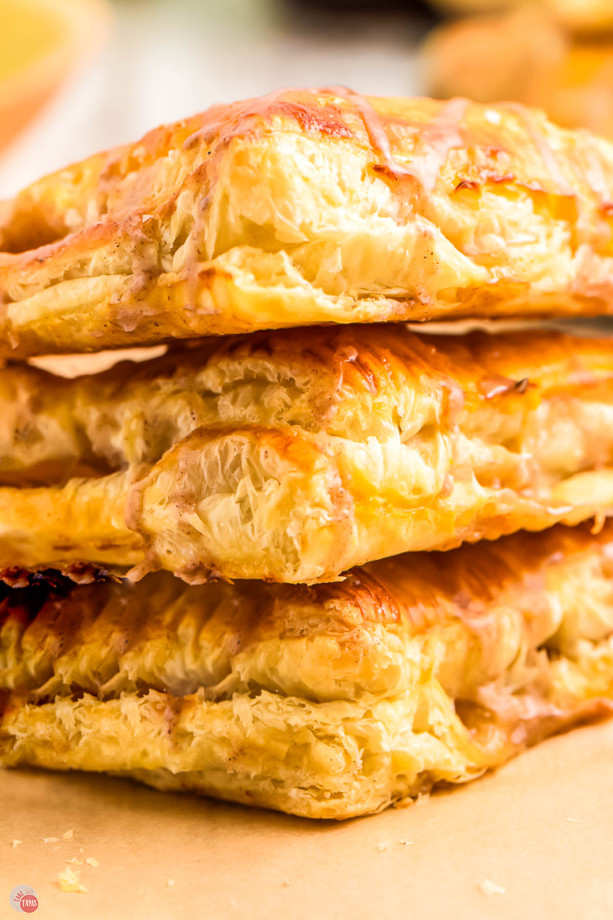 close up of apple turnovers with cinnamon icing