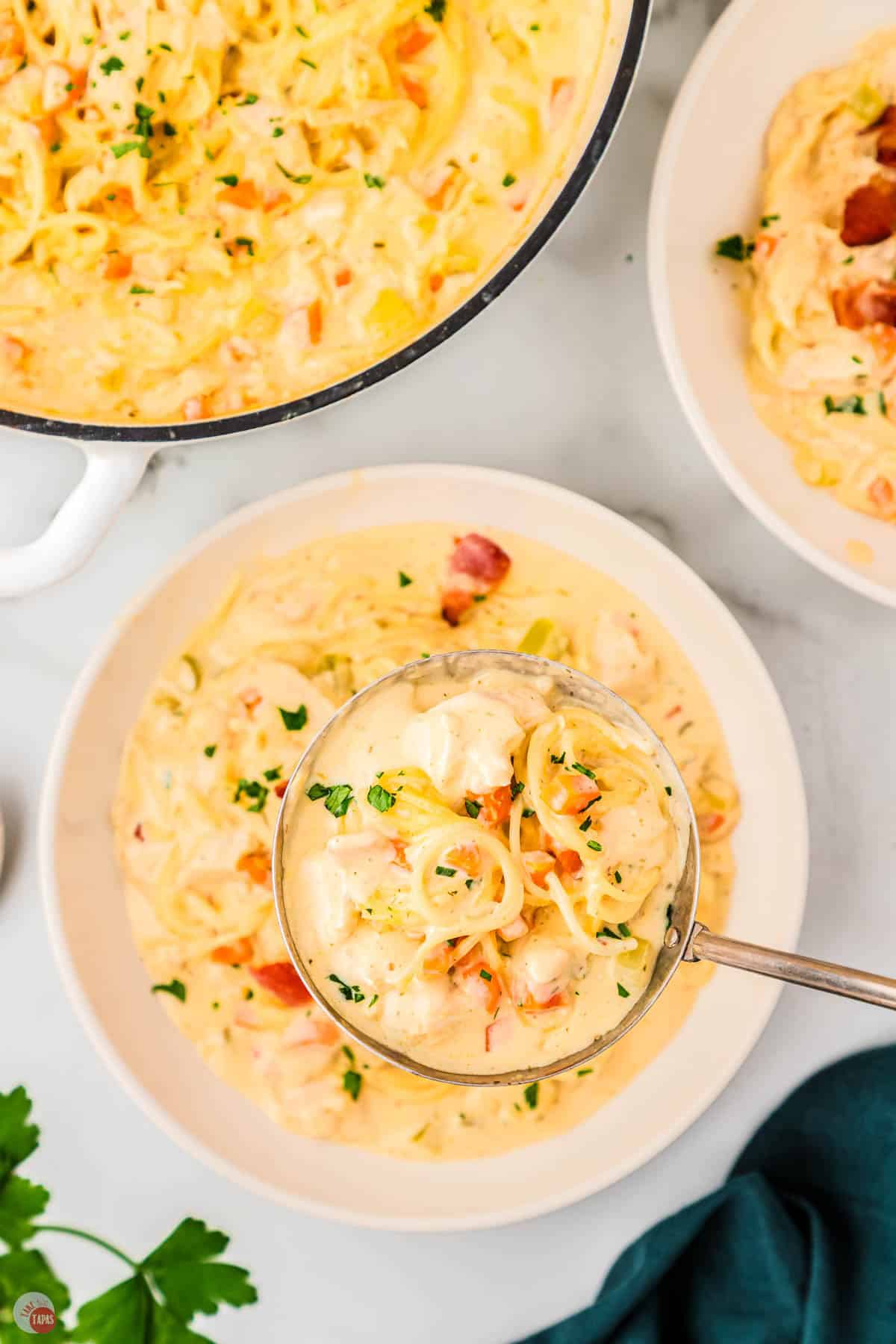 three bowls of loaded chicken noodle soup
