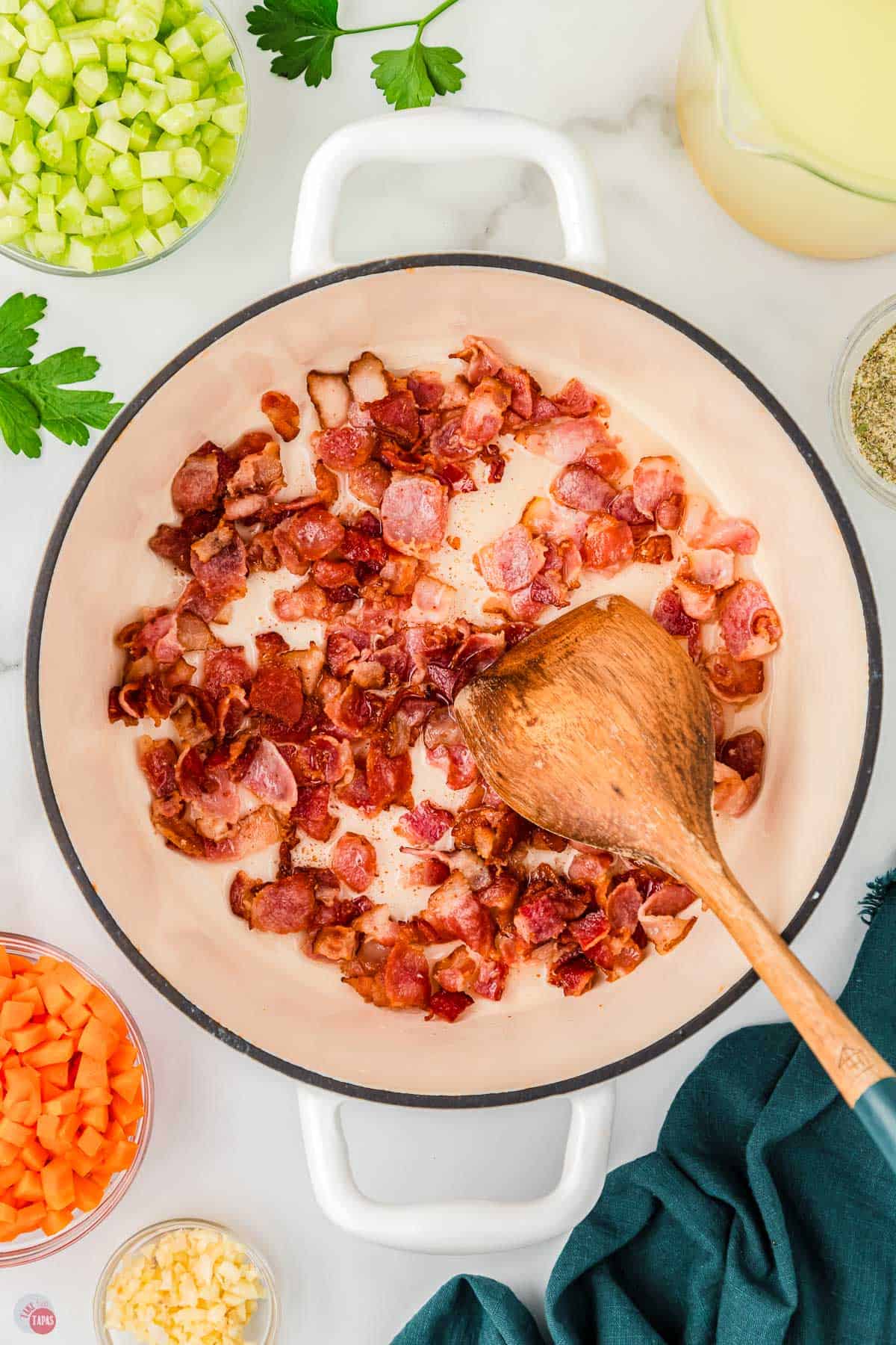 bacon cooking in a white pot
