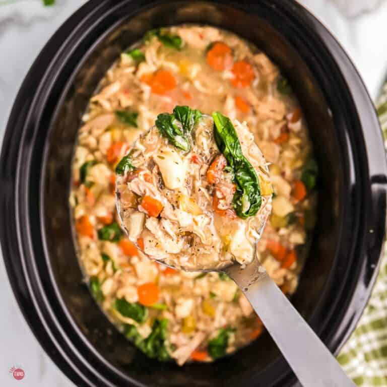soup in a black slow cooker pot