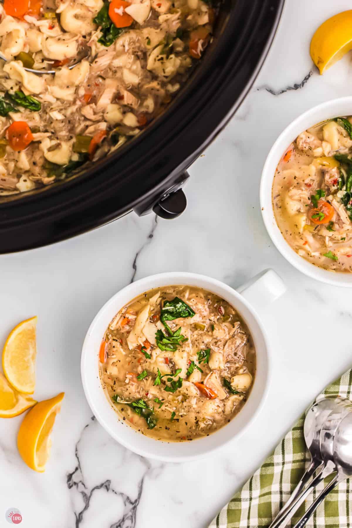 bowls of soup on a marble counter