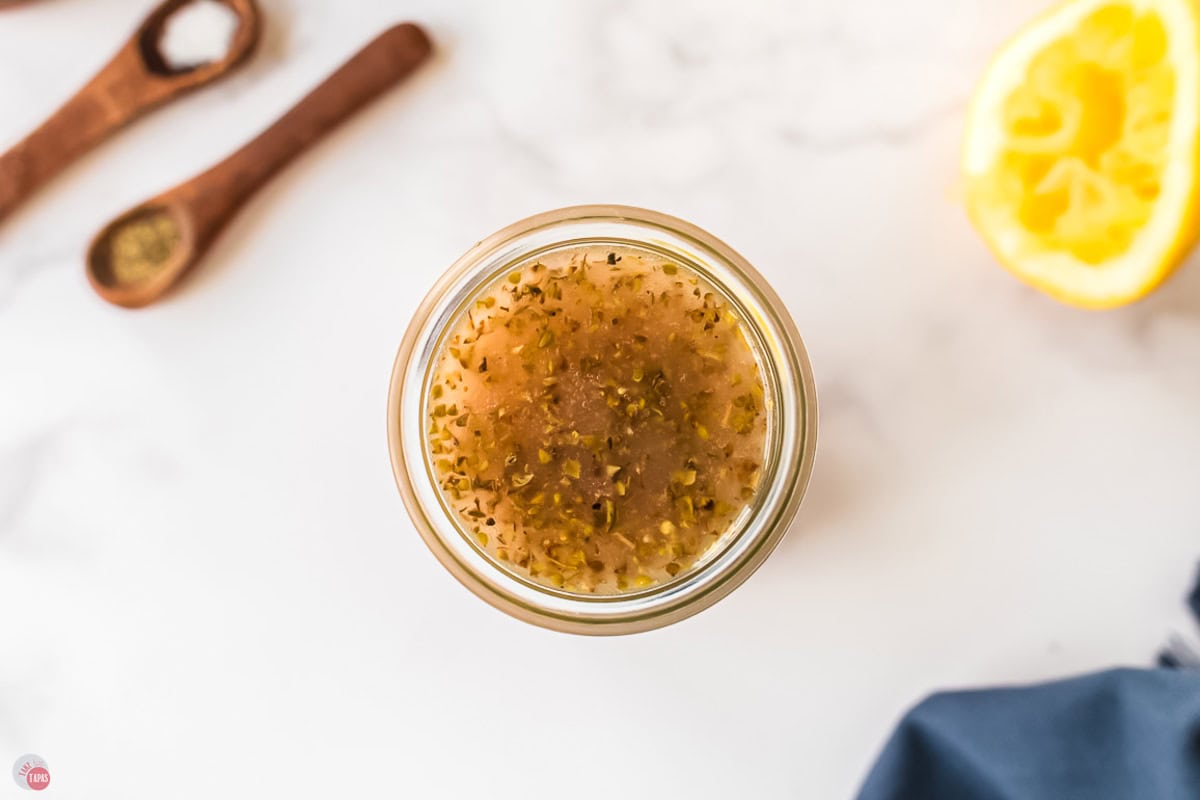overhead picture of Greek vinaigrette in a jar
