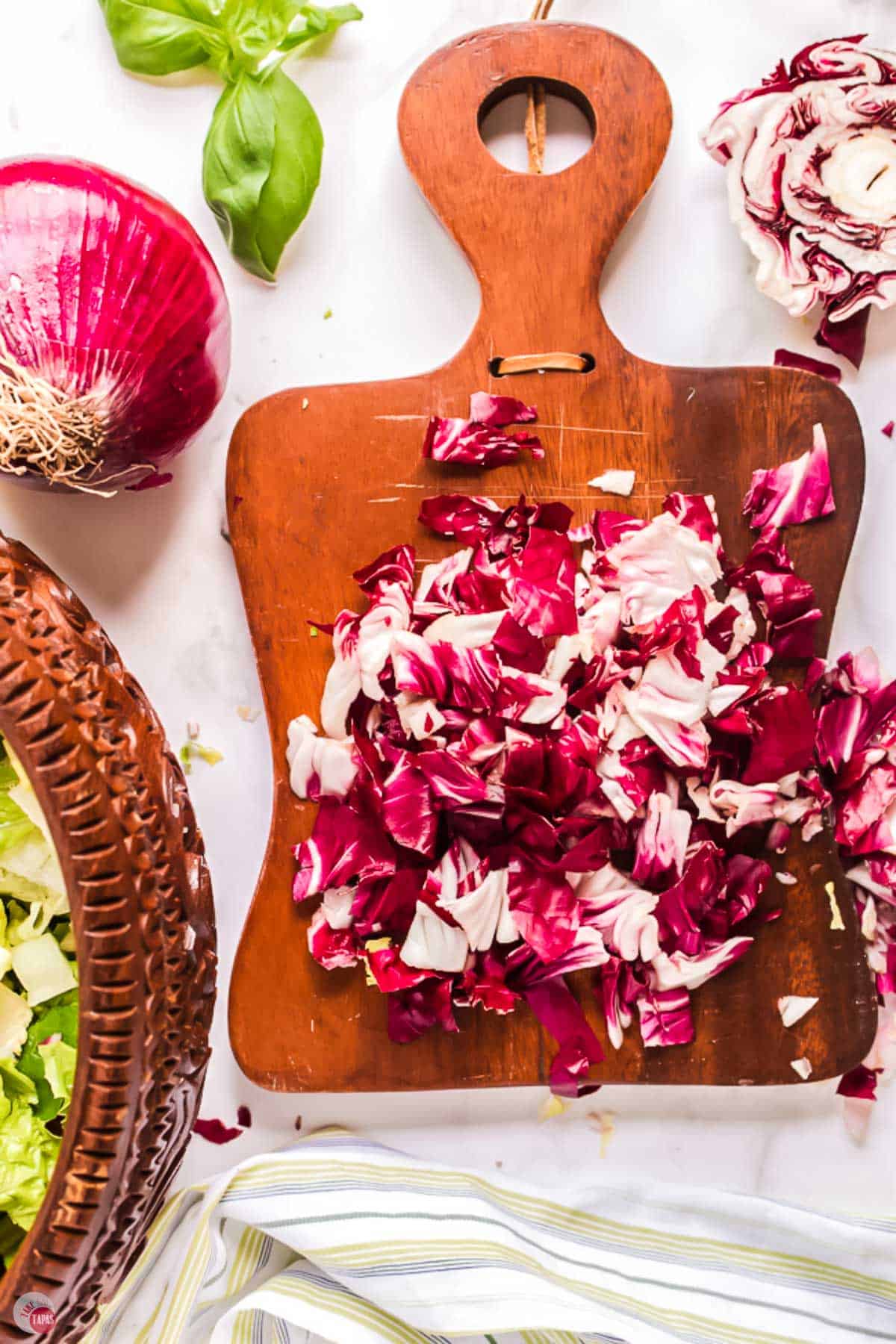 chopping radicchio on a cutting board