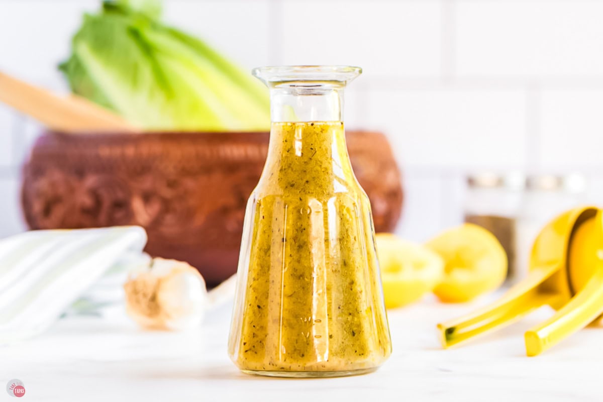 jar of homemade Italian dressing on a counter