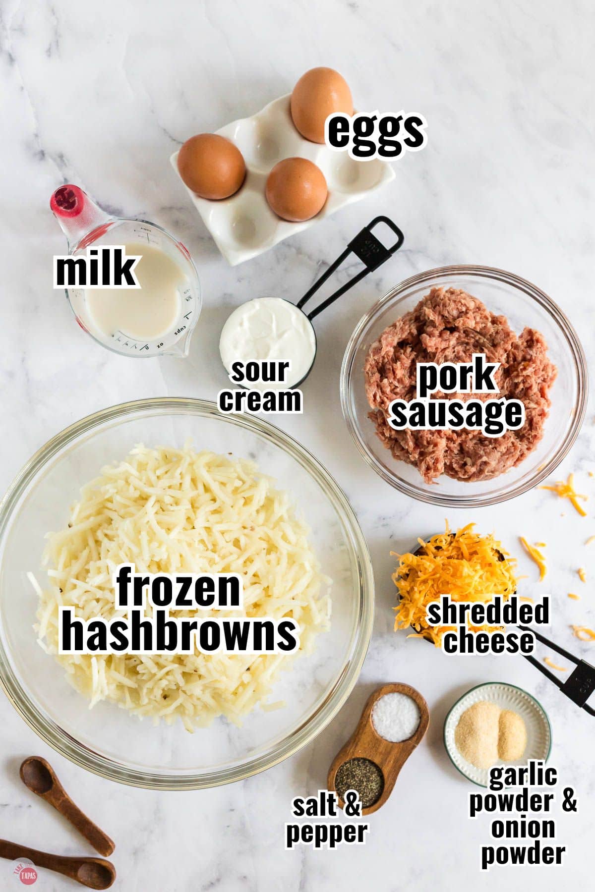 ingredients for a casserole on a marble table with text overlay labeling them