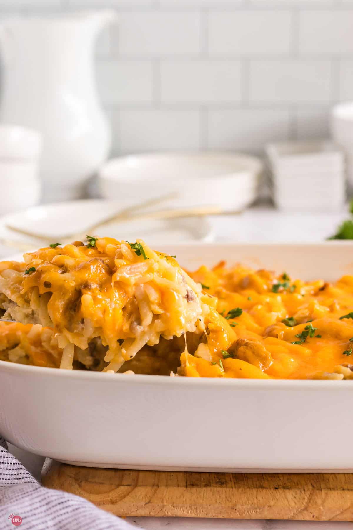 scoop of casserole being taken out of dish