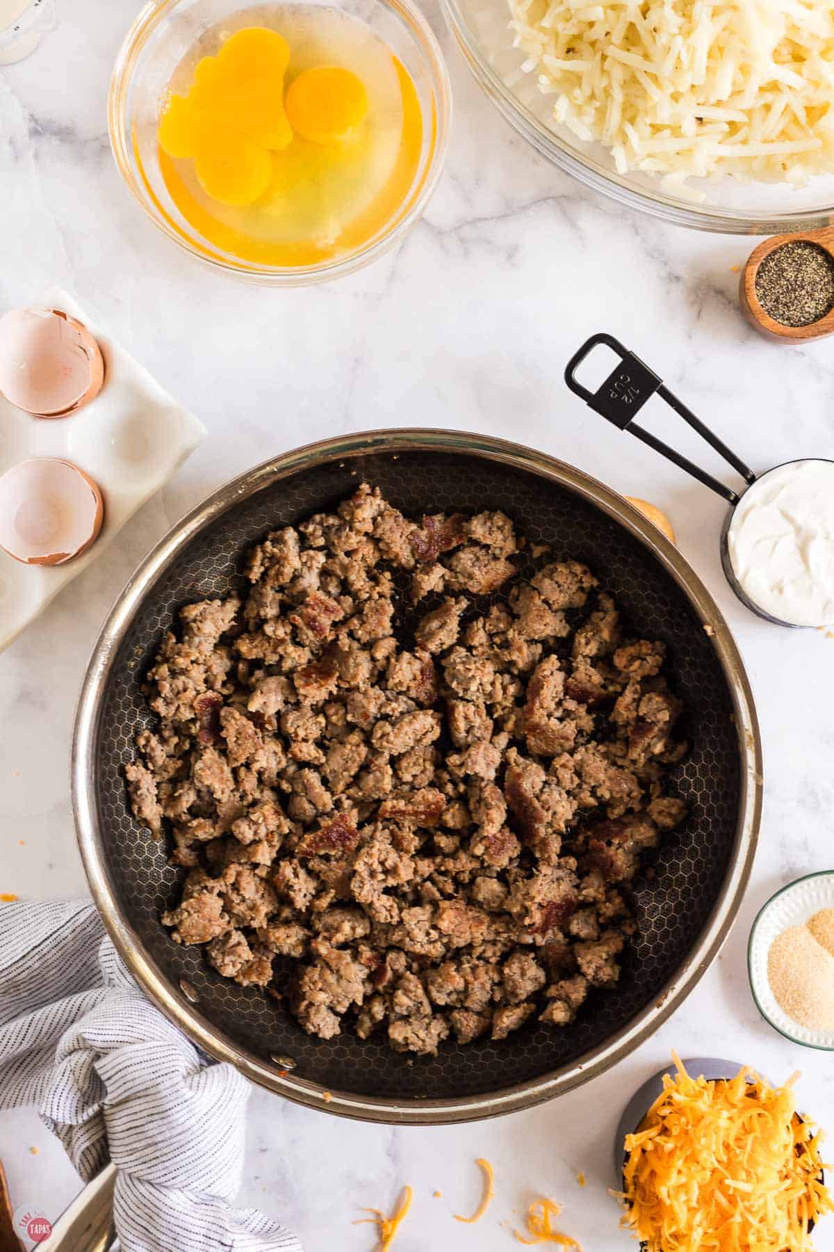 pork sausage cooking in a skillet