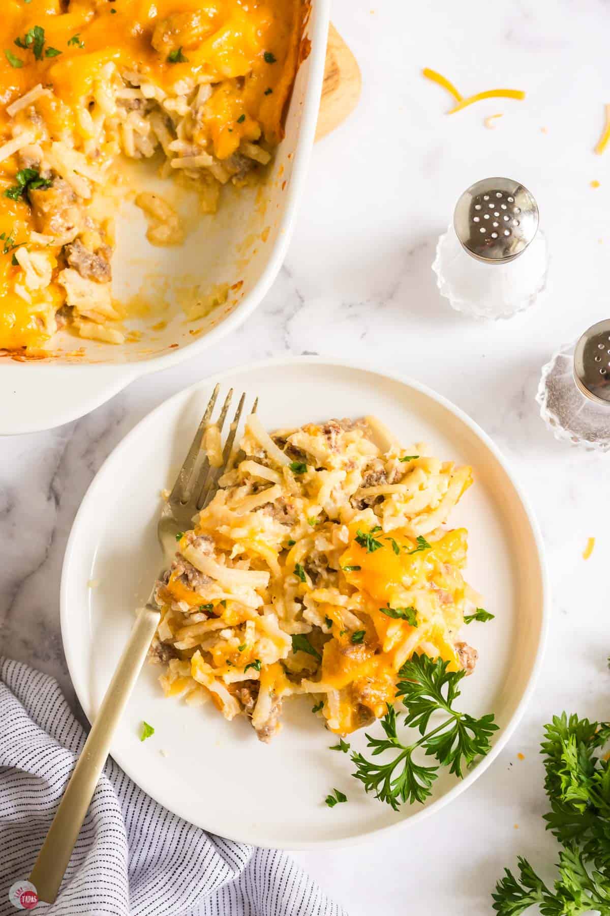 overhead picture of casserole on a plate with a fork