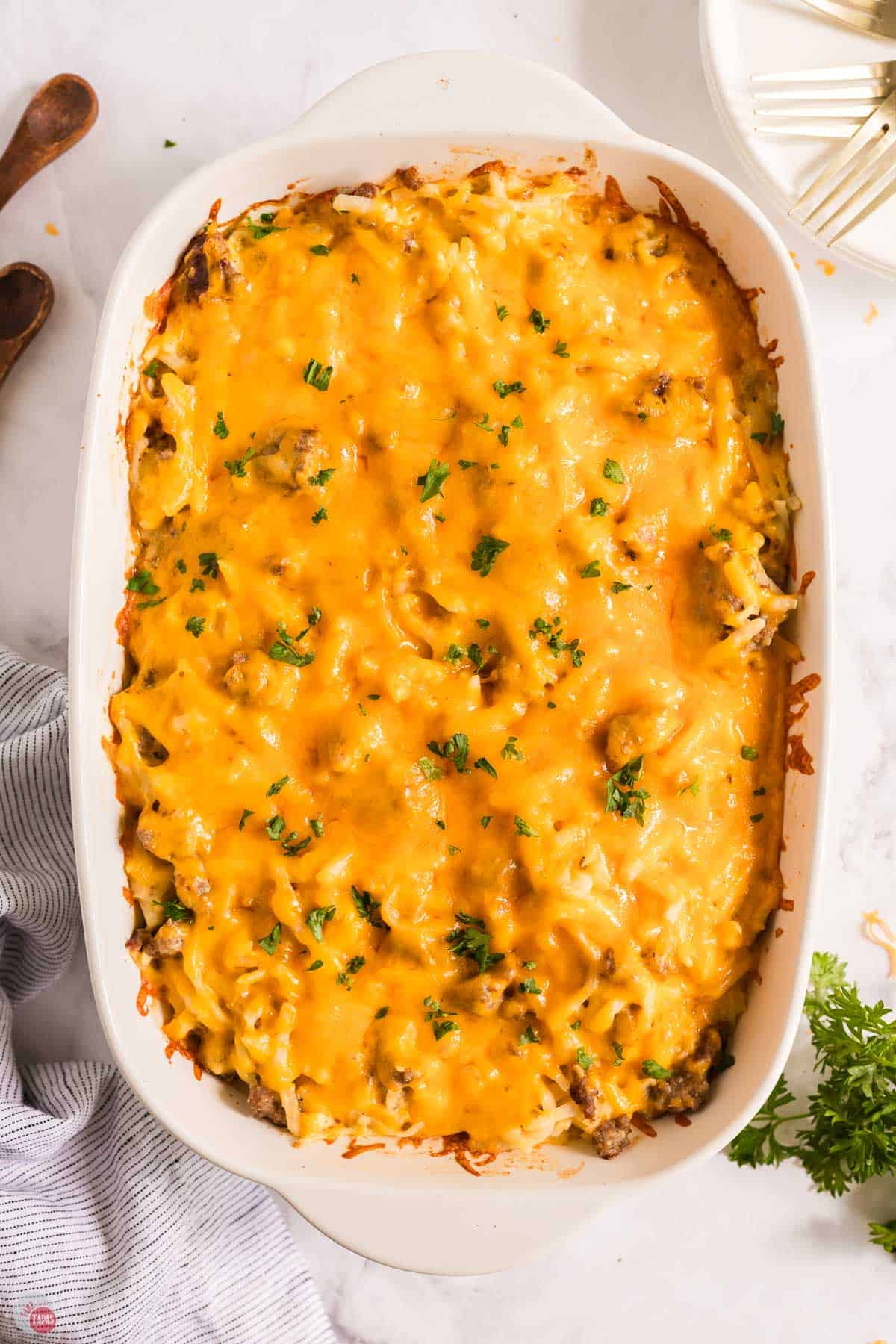 baked sausage and hashbrown casserole in a white dish