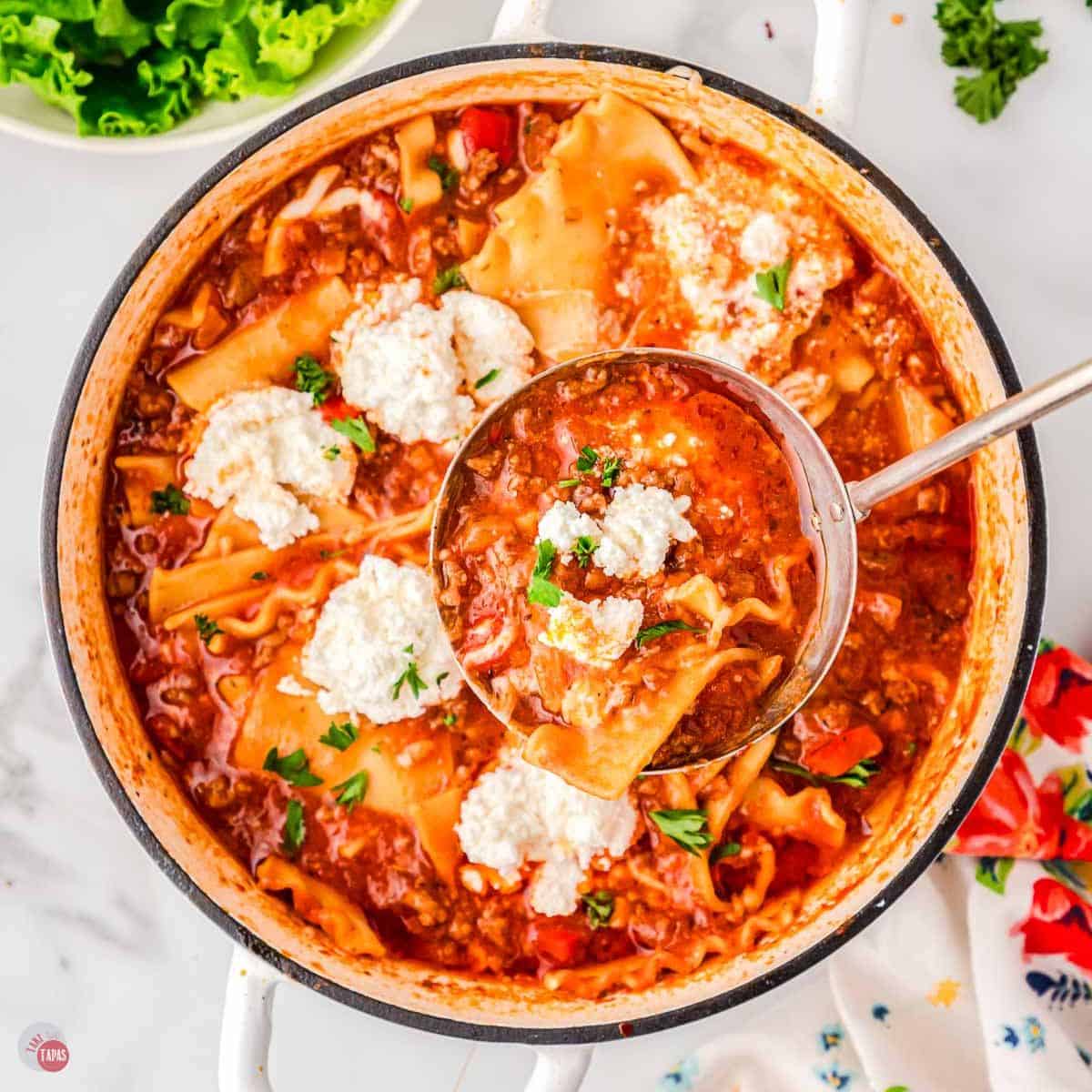 pot of lasagna soup with a ladle