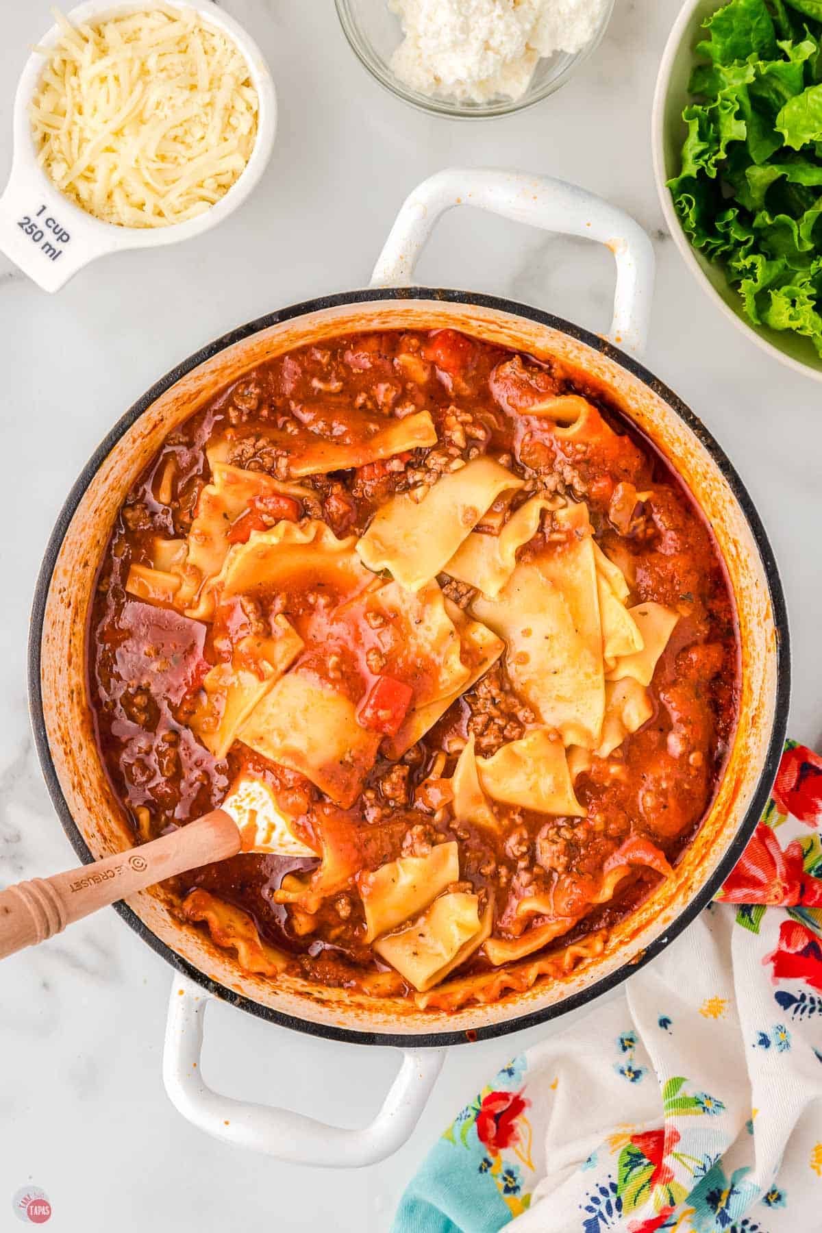 lasagna soup in a pot with a spatula
