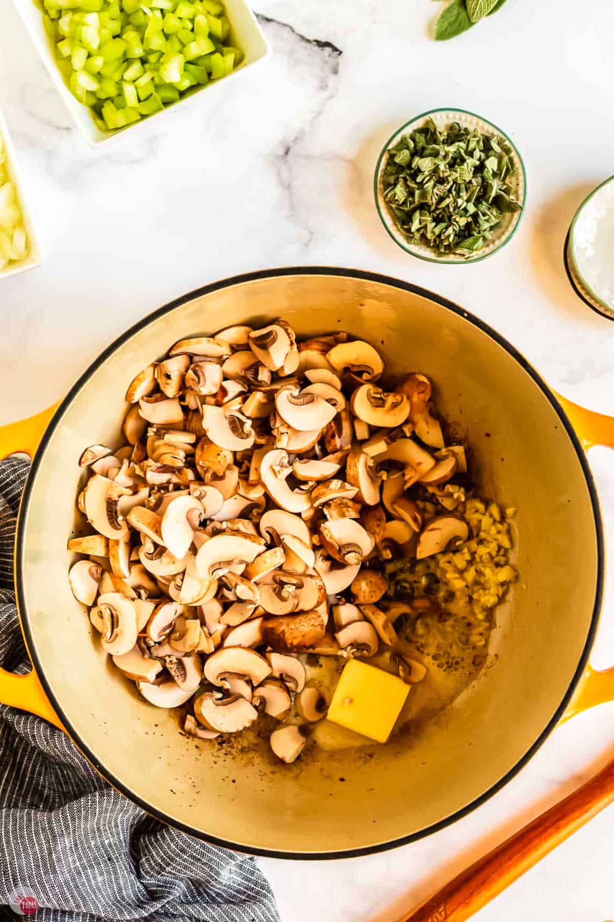 mushrooms and butter in a pot