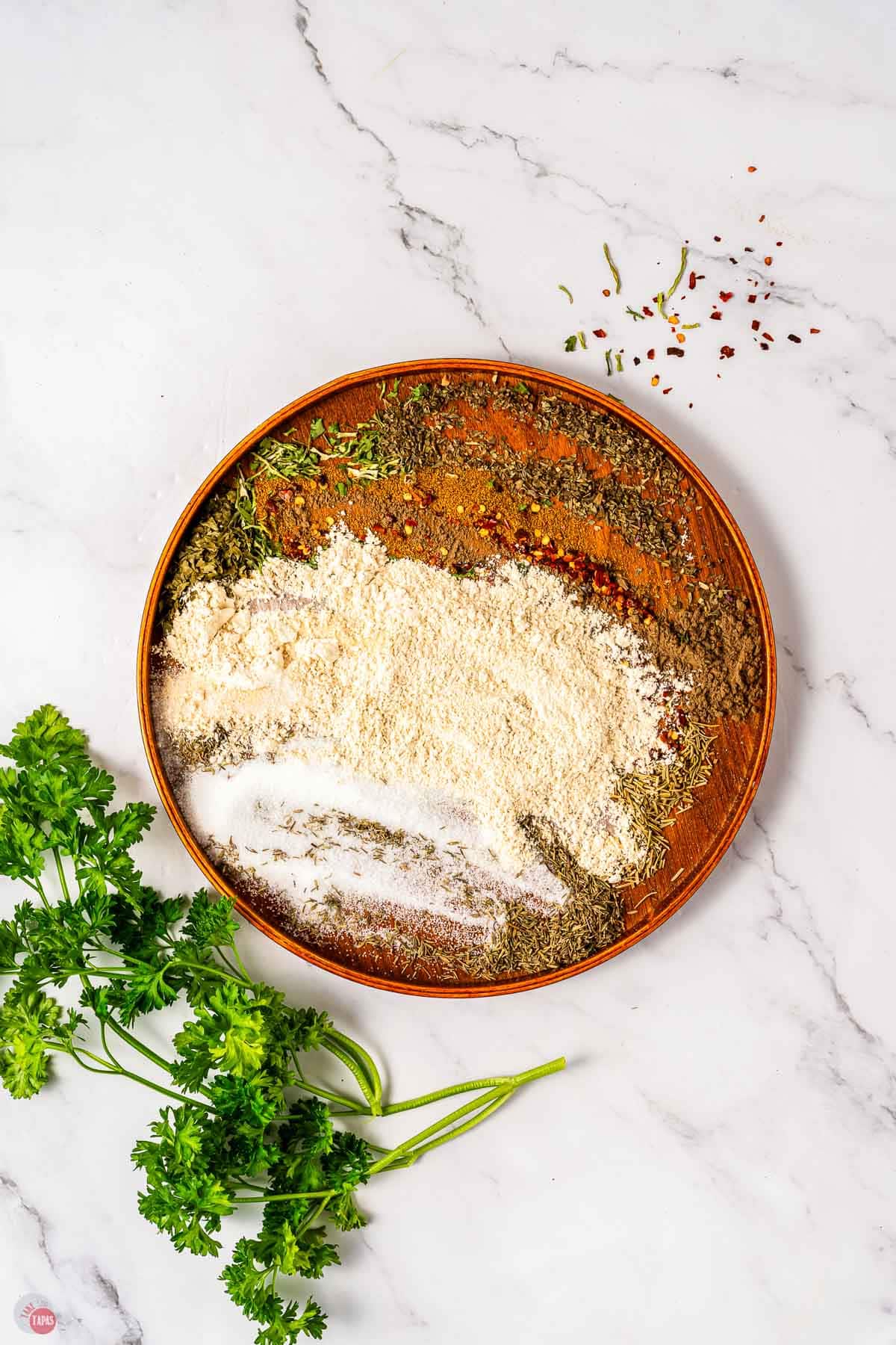 spices smeared on a wood plate