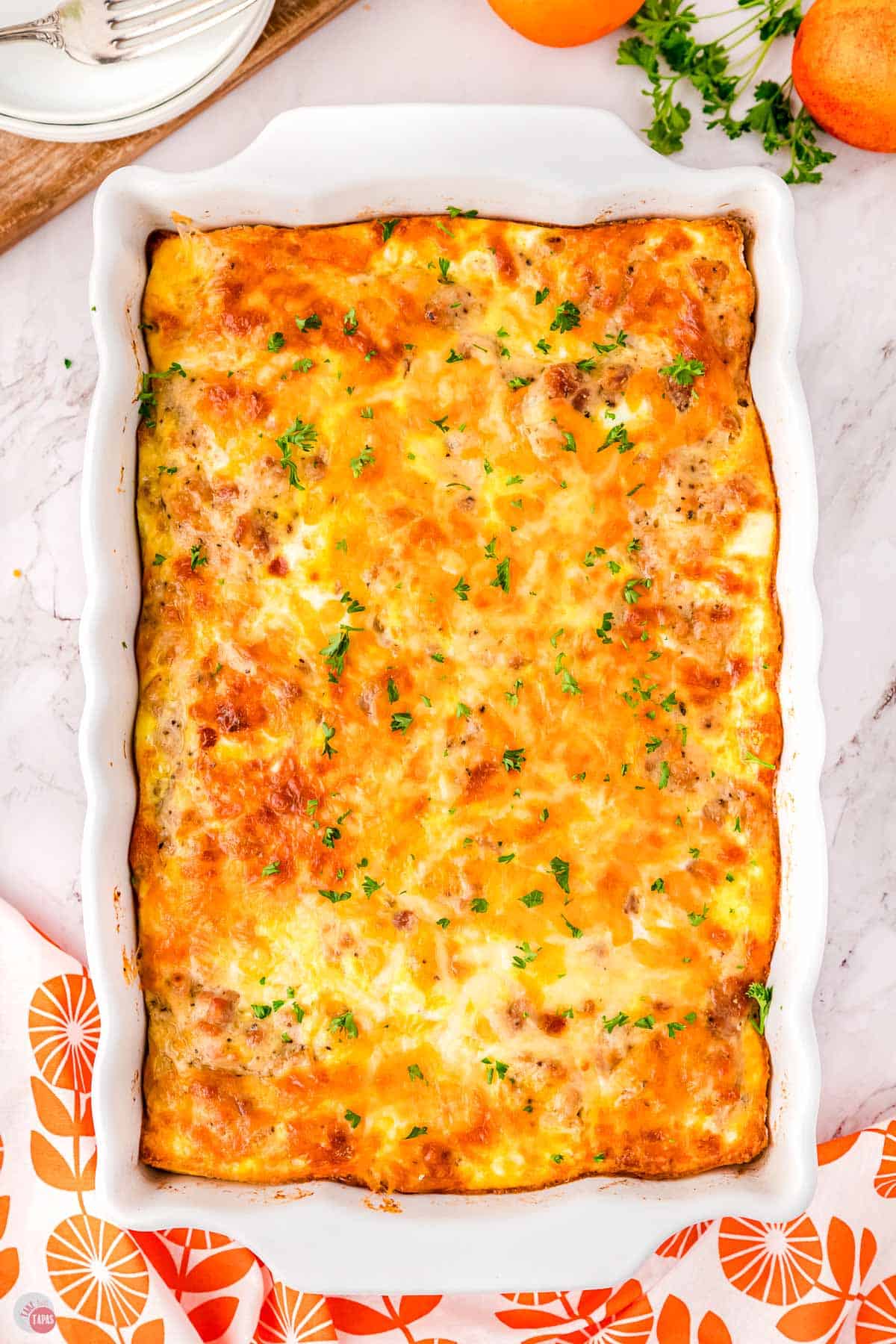 baked biscuits and gravy casserole in a white dish