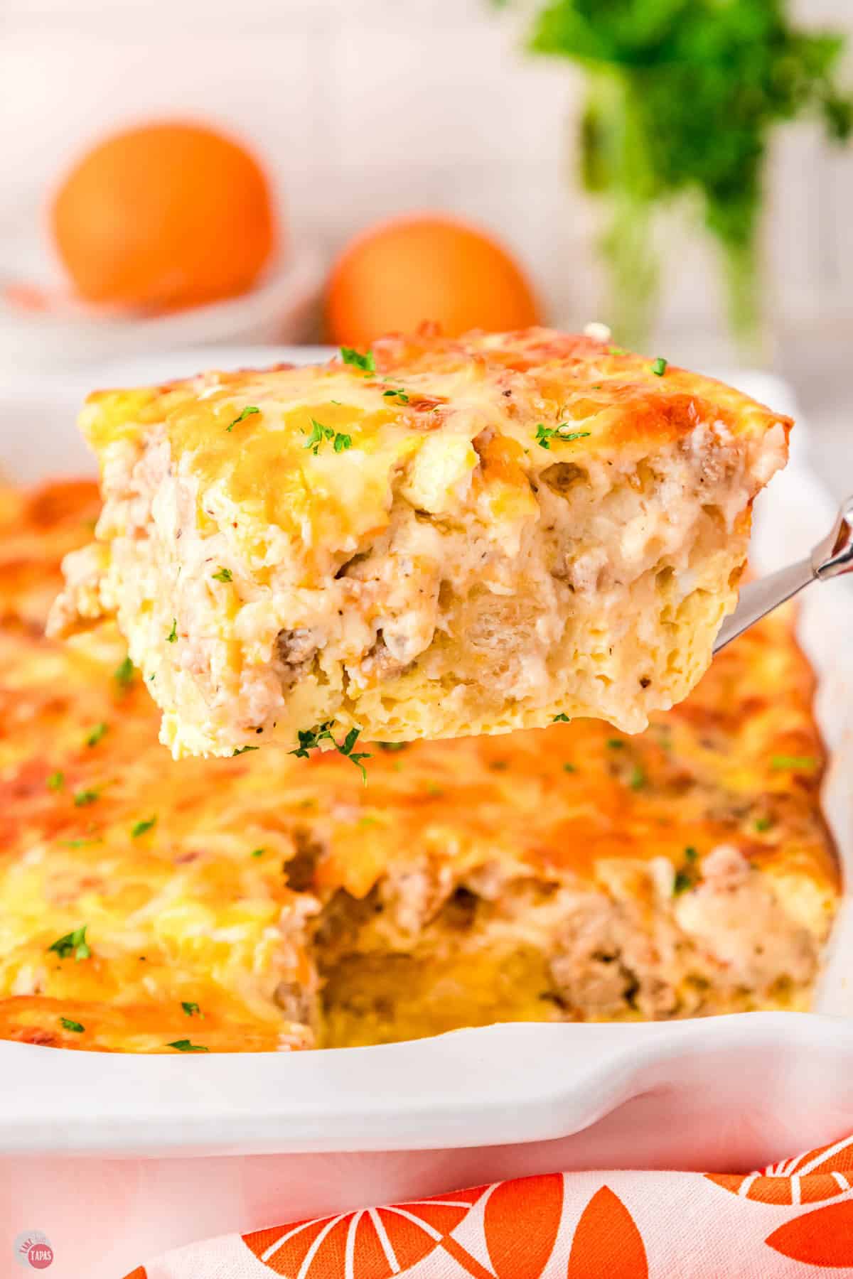 spatula holding a square of casserole on it