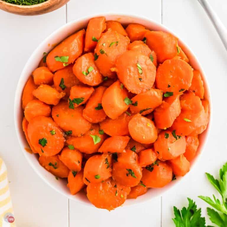 bowl of carrots topped with parsley