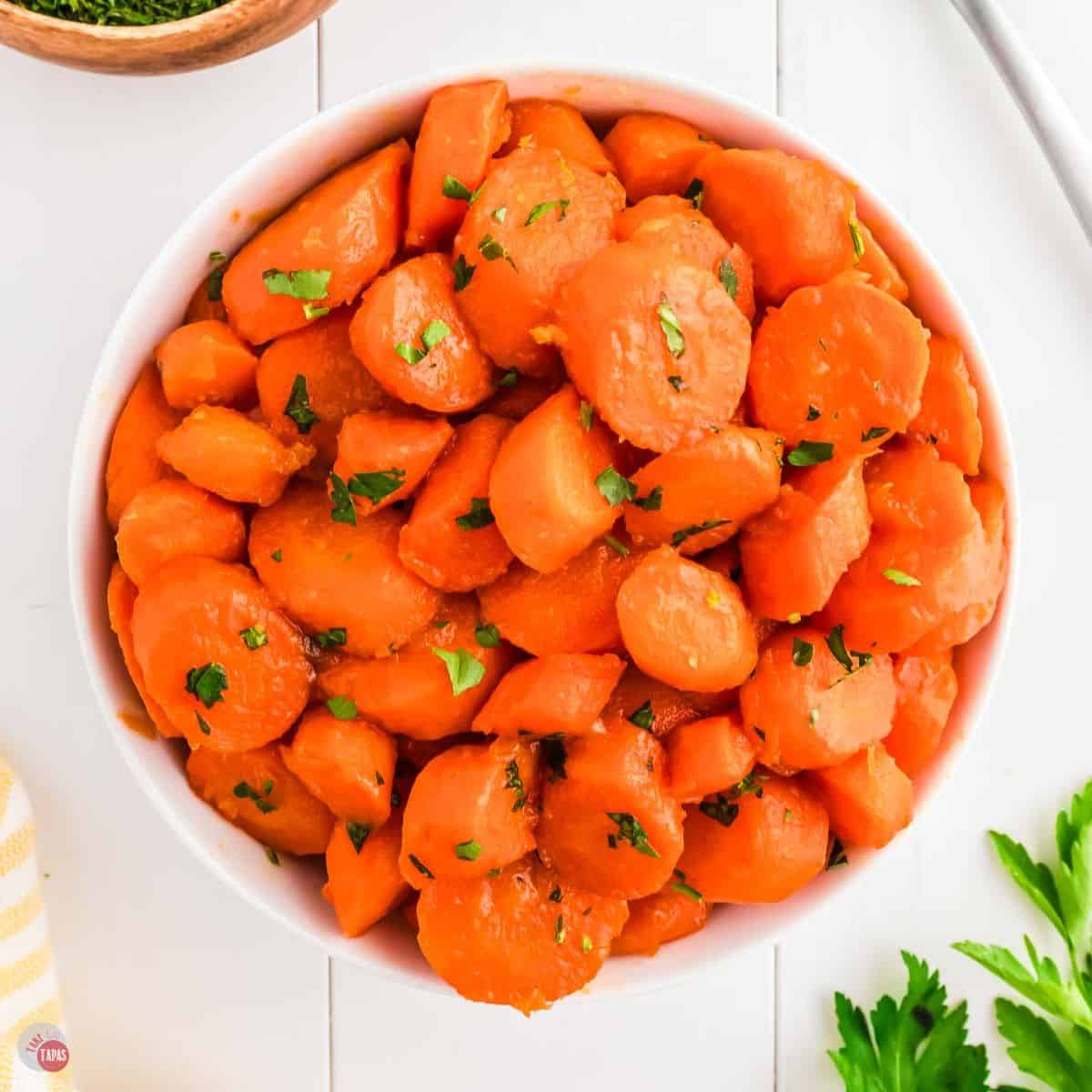 bowl of carrots topped with parsley