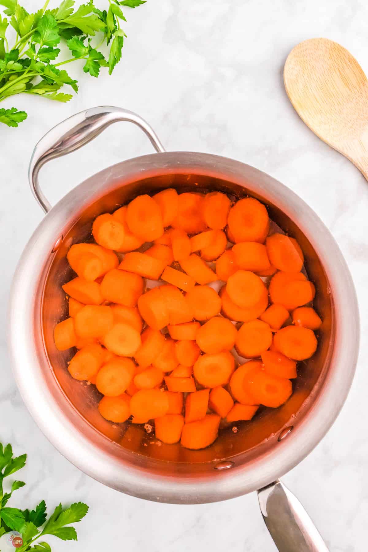 sliced carrots in a pot with water