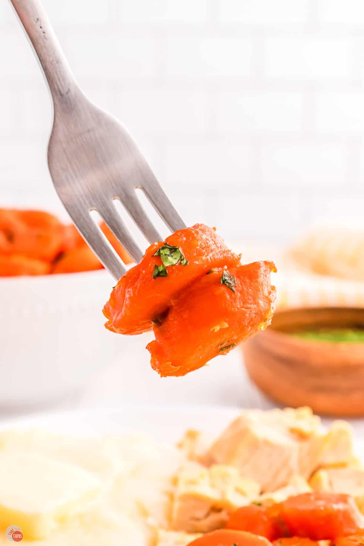fork with two slices of carrots on it