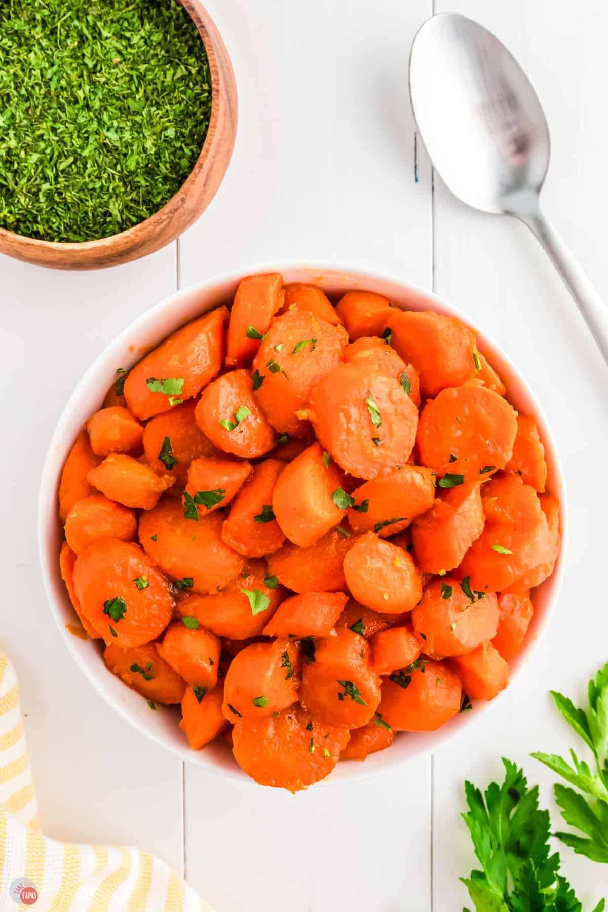 bowl of carrots with parsley sprinkled on top