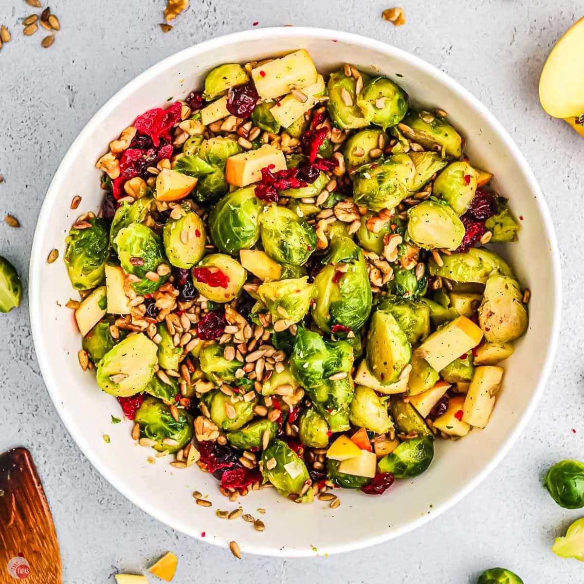 bowl of salad with sprouts and apples