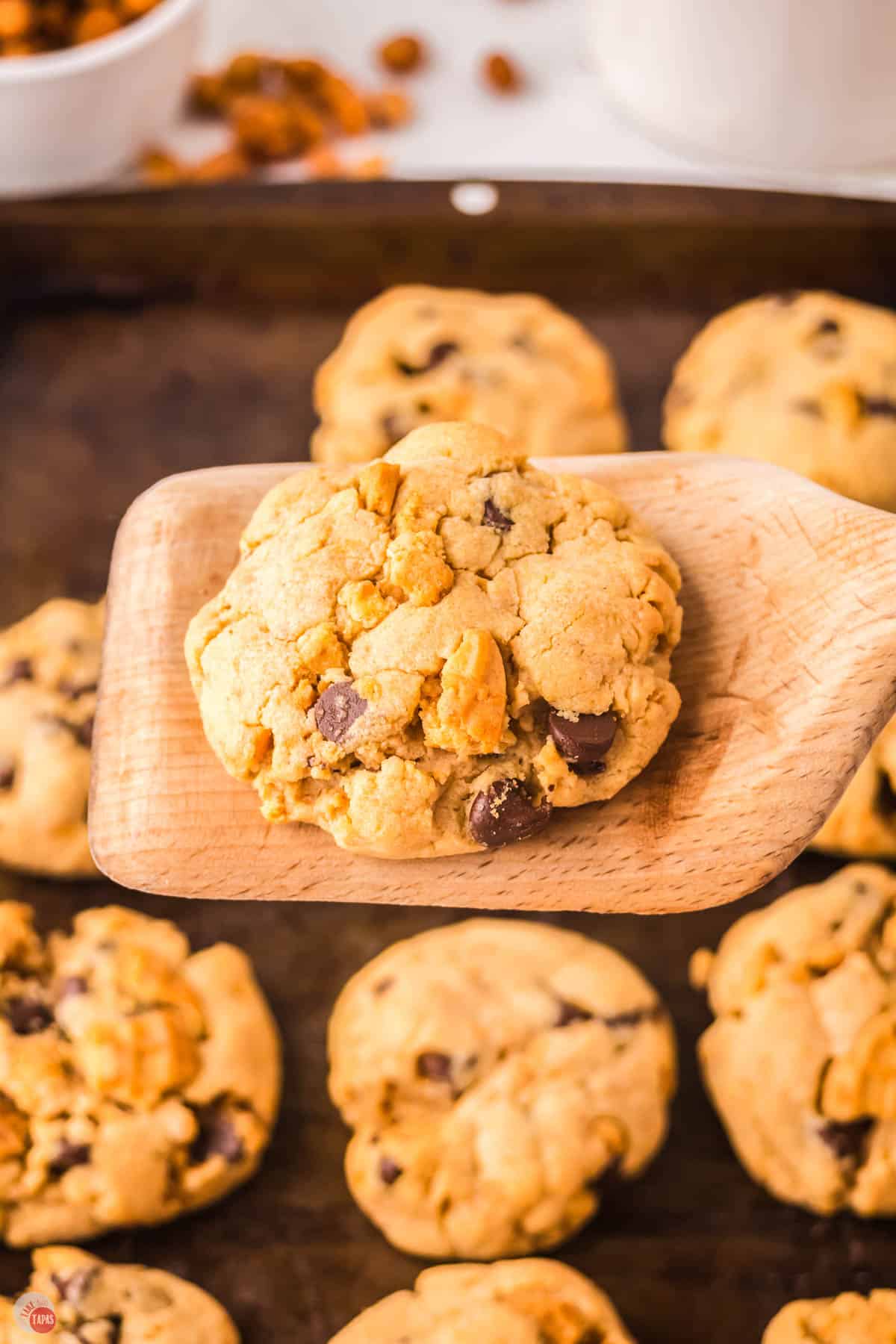 wood spatula with a cookie on it