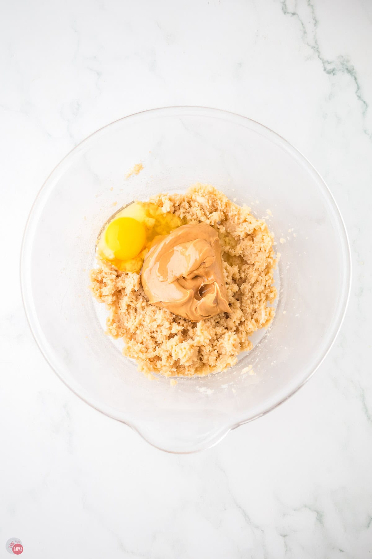 butter and sugar in a bowl with peanut butter on top