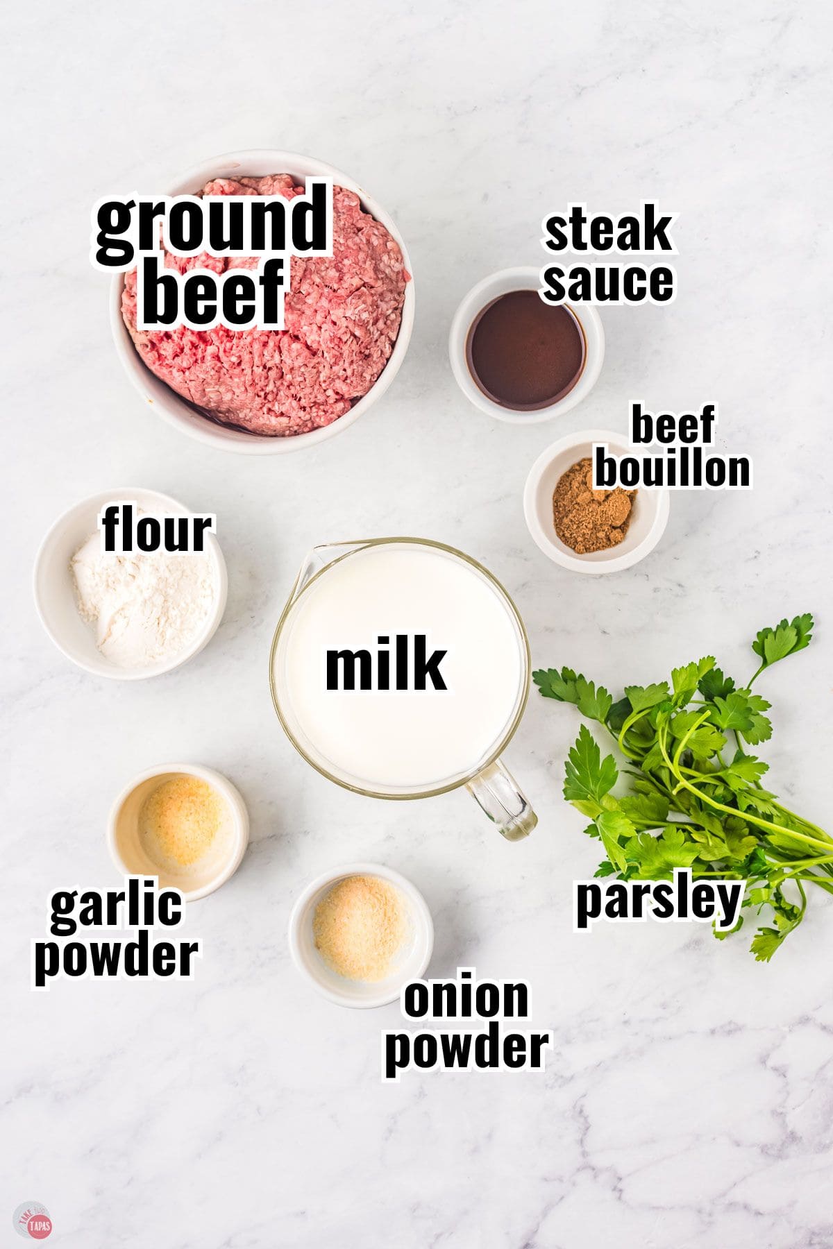 ingredients for hamburger gravy in individual bowls with text overlay labeling them