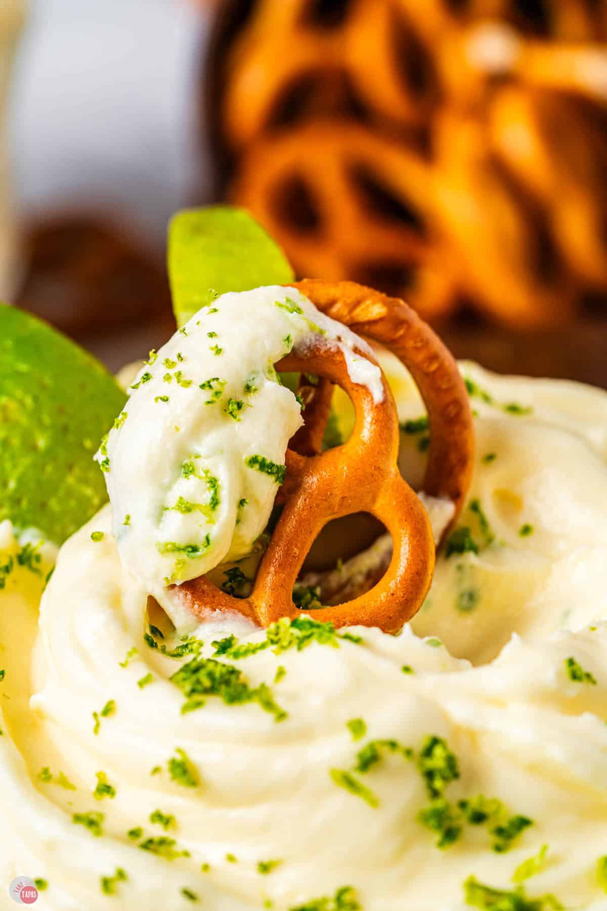 close up of a creamy dip on a pretzel twist