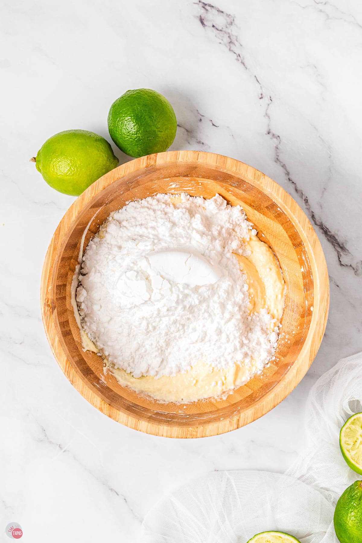 powdered sugar in a wood bowl