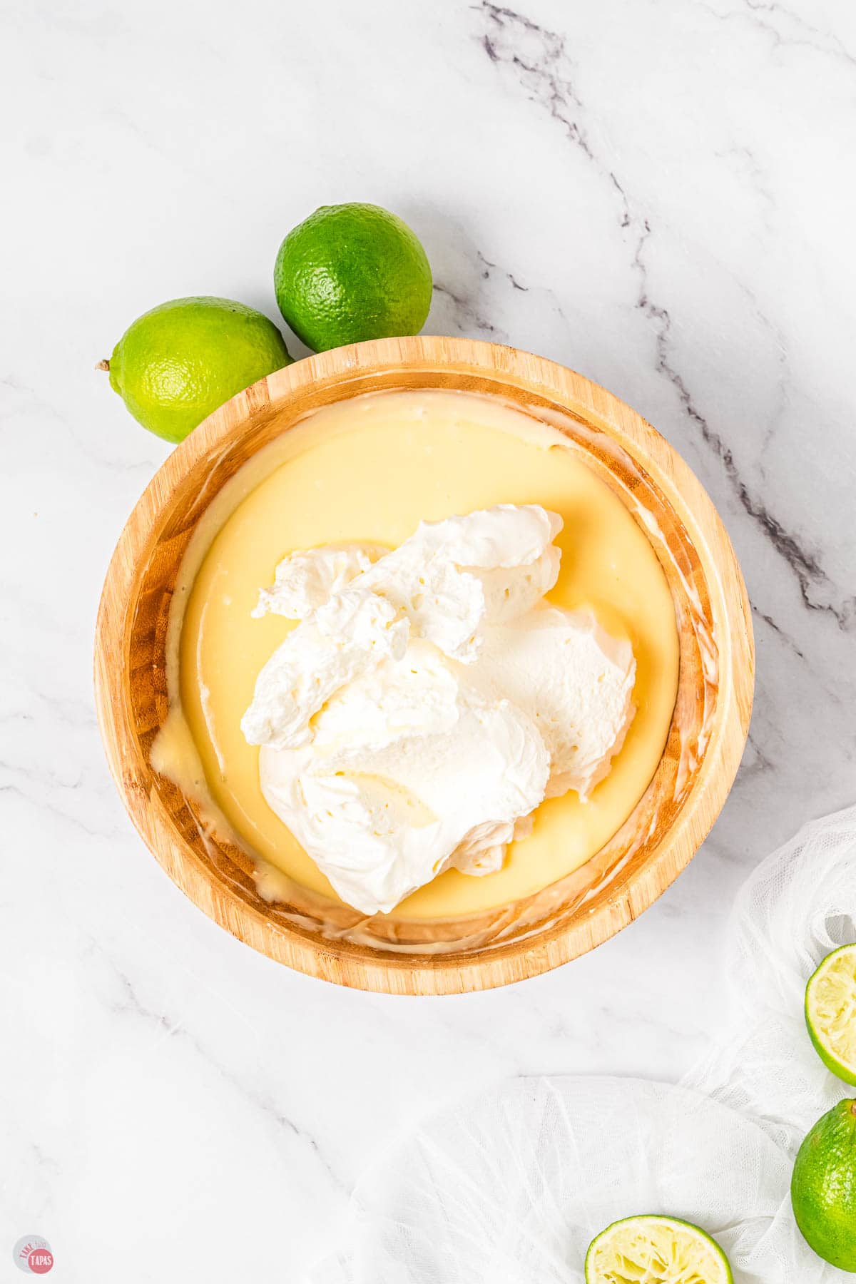 margarita dip with whipped topping on top of the bowl