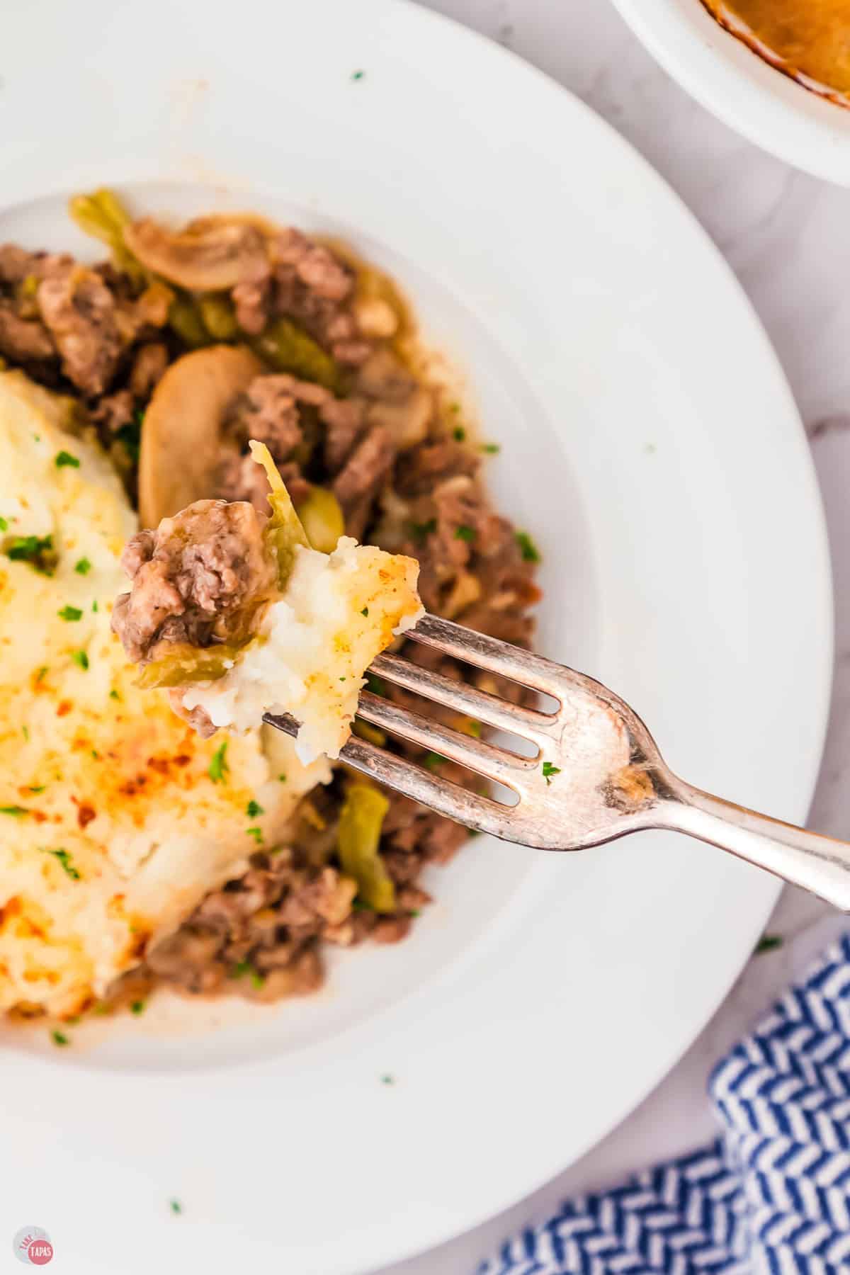 overhead picture with fork and a bite of casserole