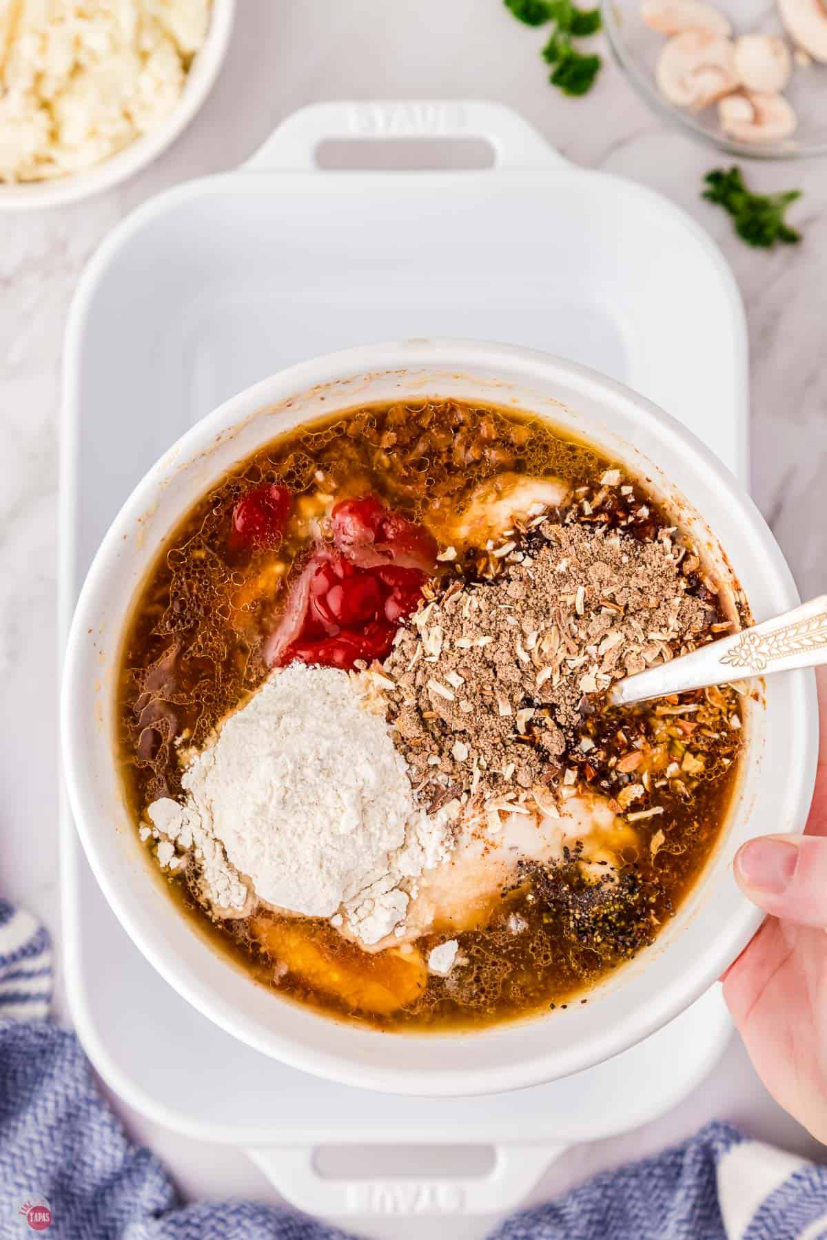 gravy ingredients in a bowl with a spoon