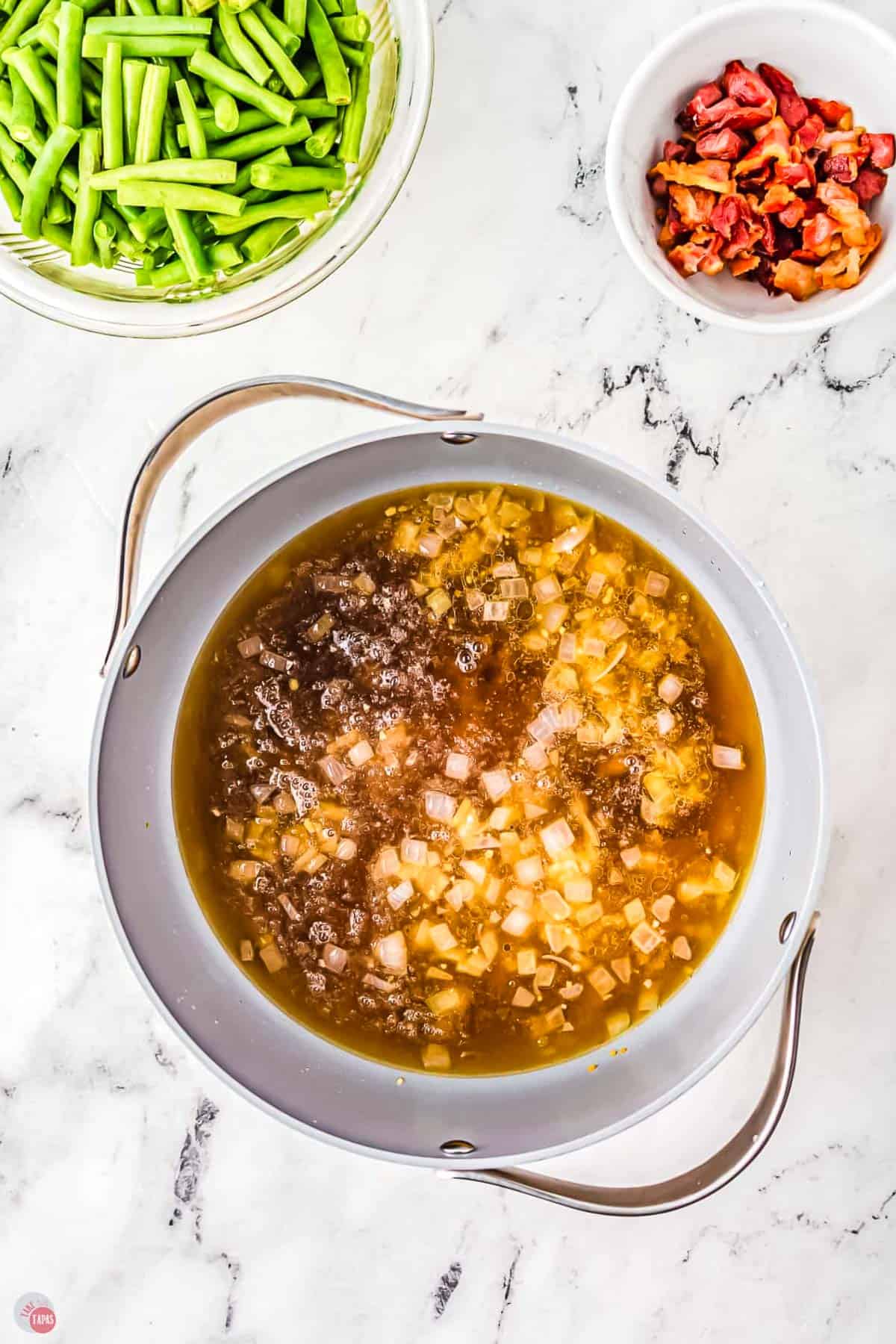broth and brown sugar simmering in a skillet