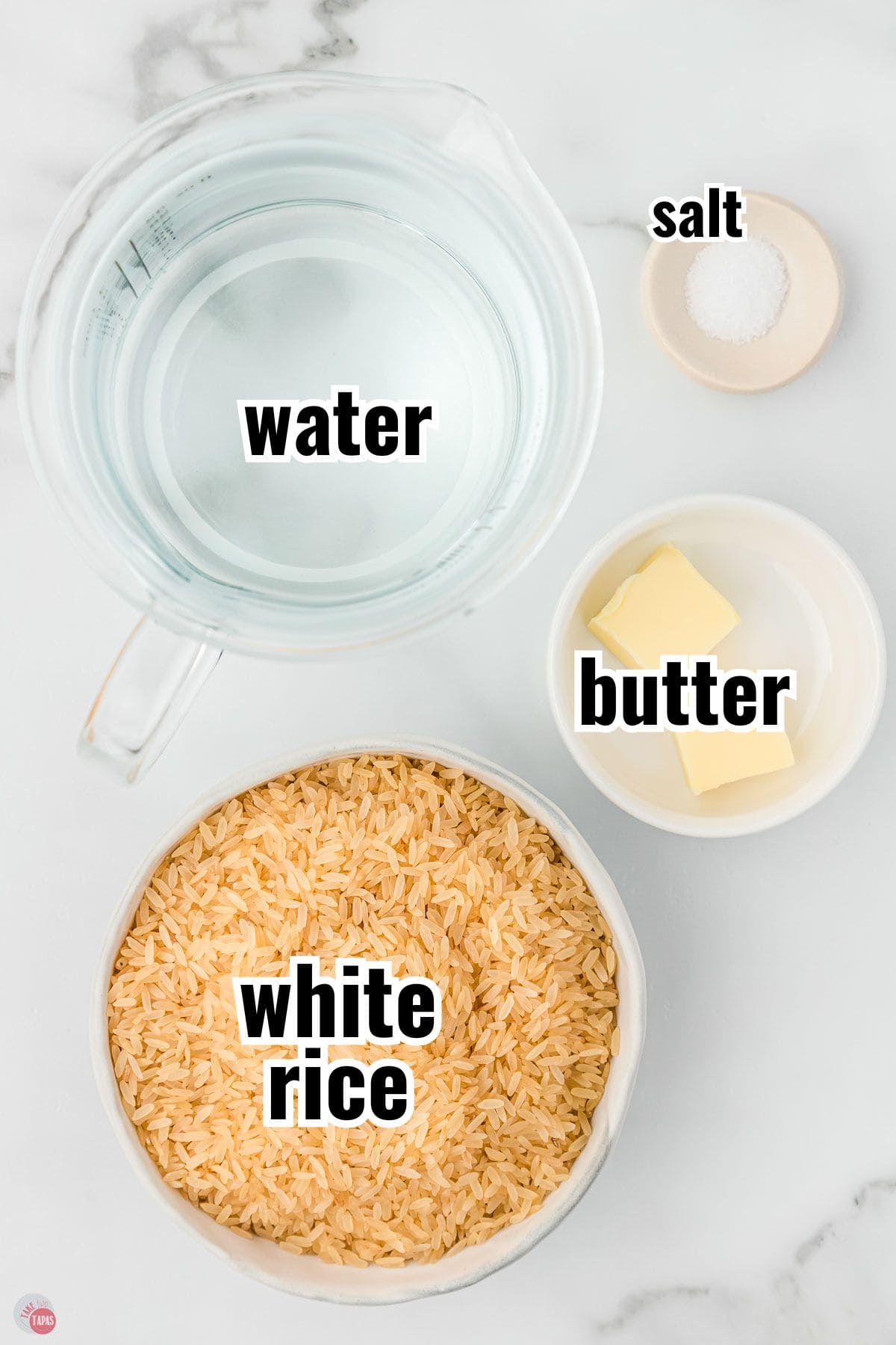 ingredients for a rice recipe in individual bowls with text overlay labeling them