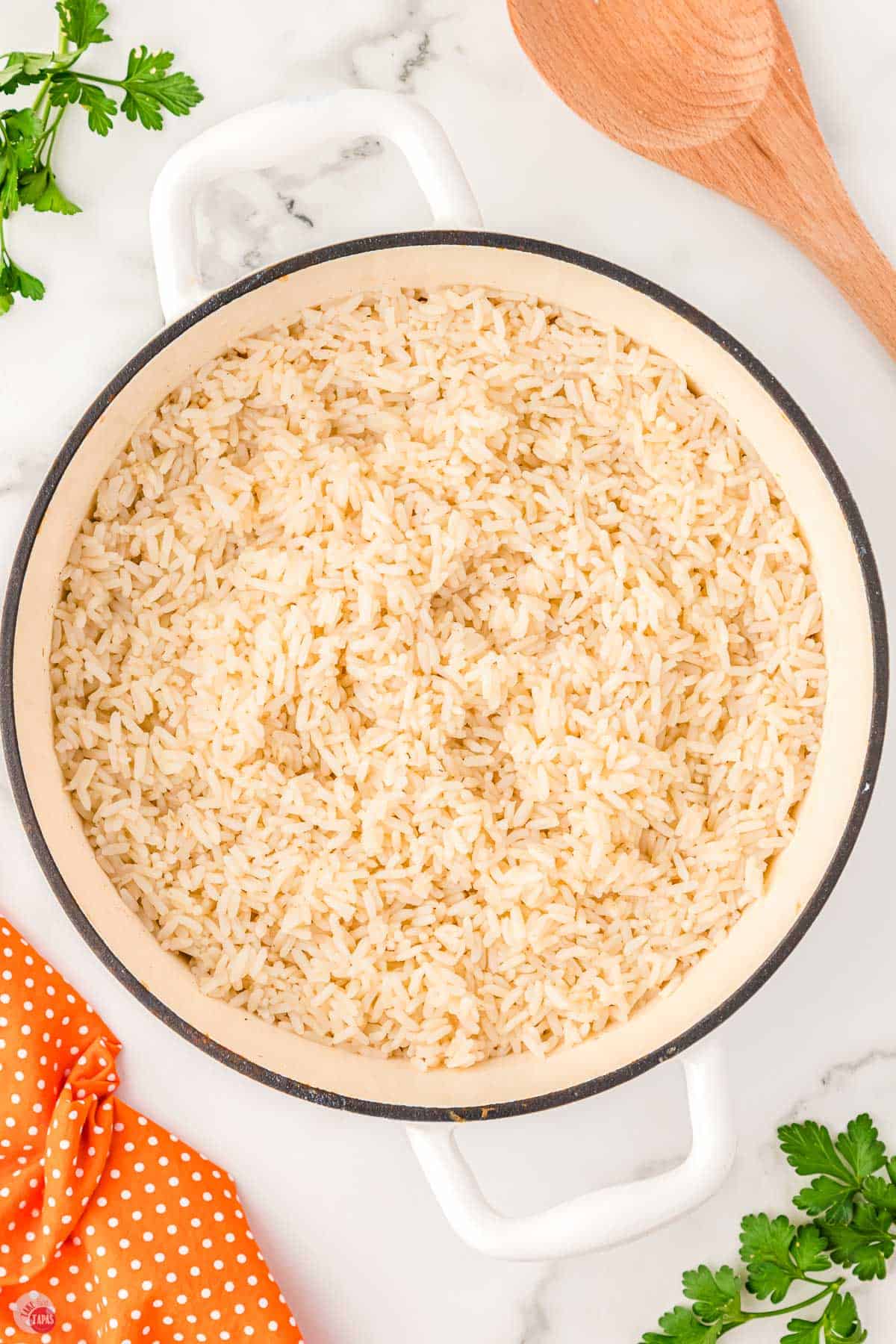 white pot filled with cooked white rice in it