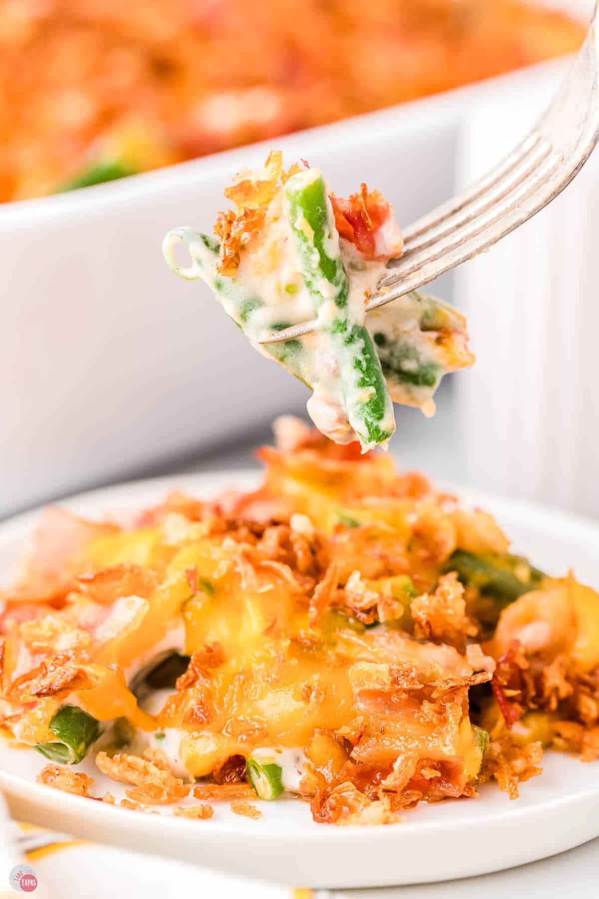 fork with a bite of green bean casserole on it