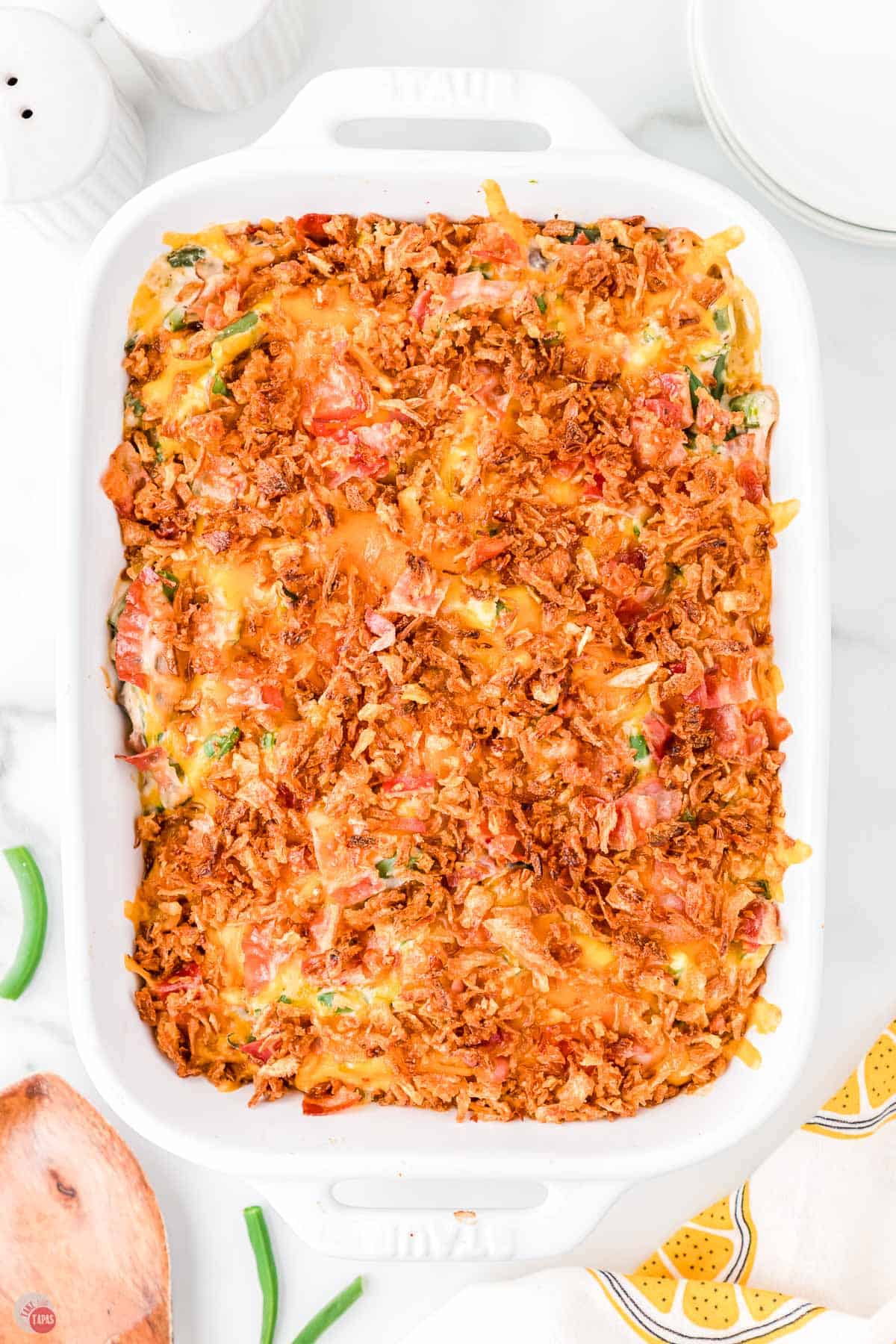 baked casserole in a white dish with cheese on top