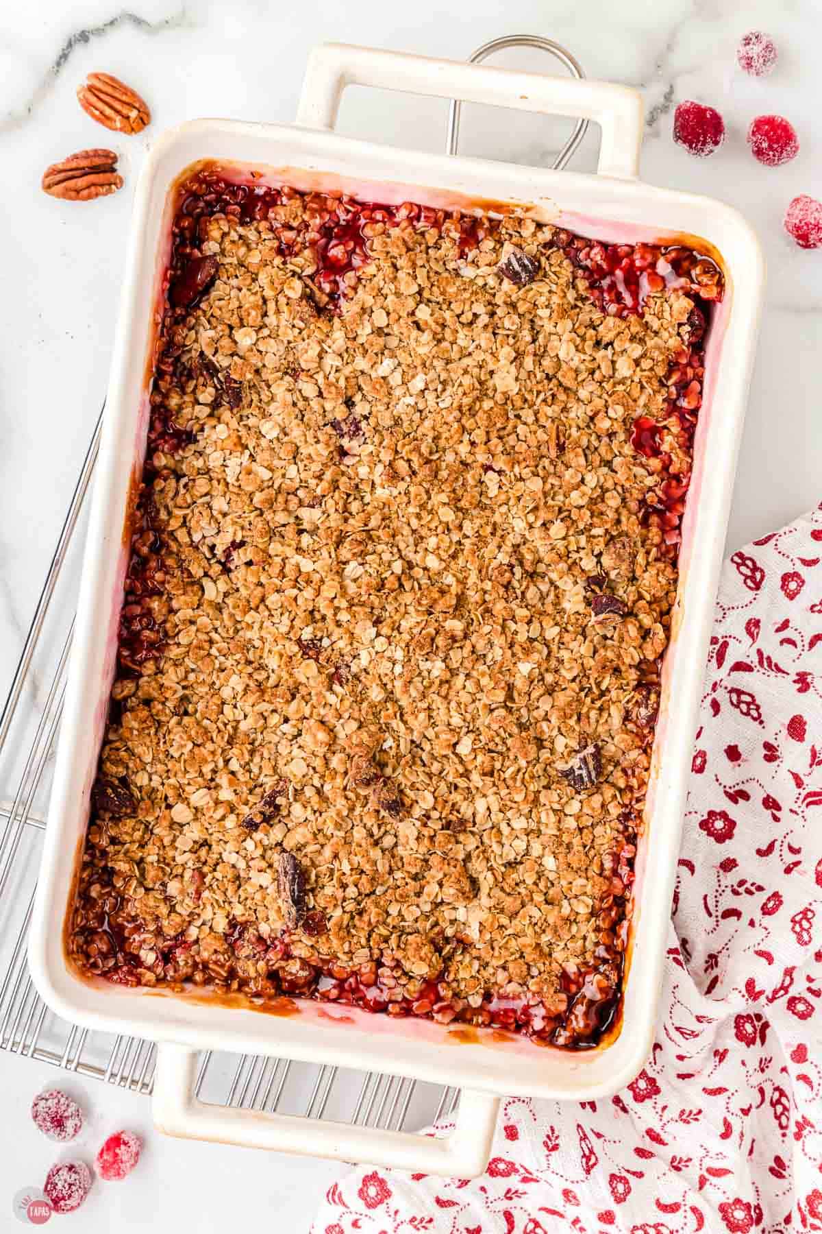 baked cranberry casserole in a white dish on a wire cooling rack