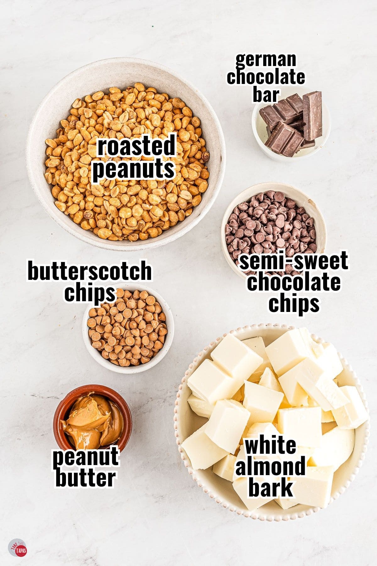 ingredients for peanut clusters recipe in individual bowls with text overlay labeling them