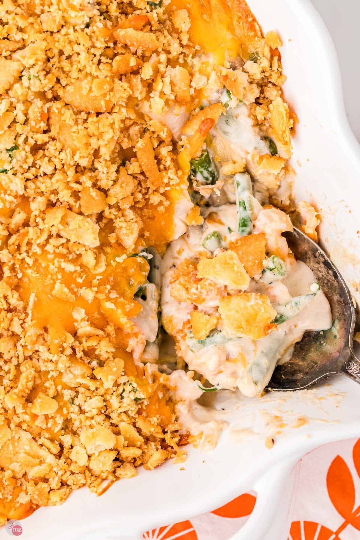 spoon with a scoop of casserole in a dish