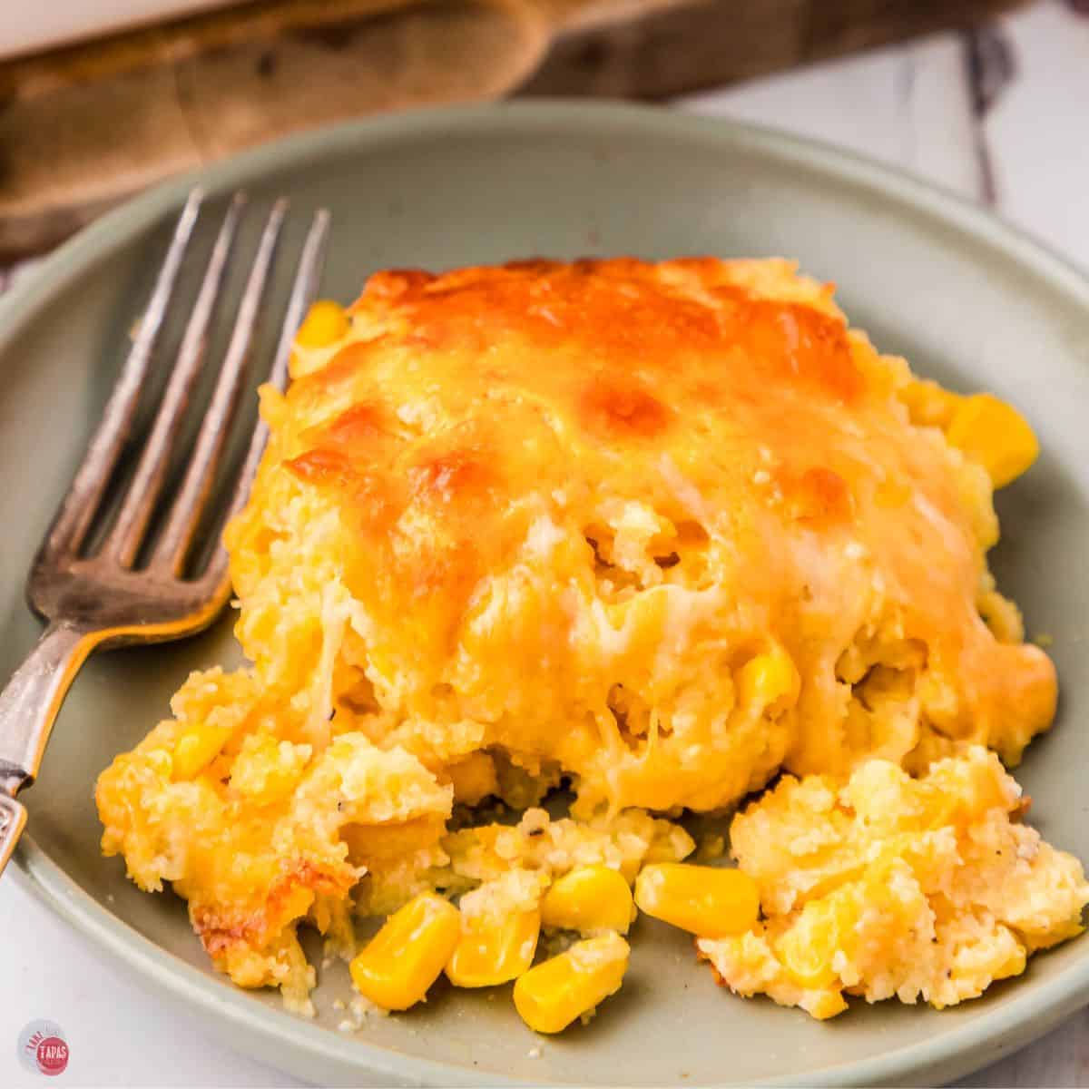 Plate of corn casserole with a fork on it