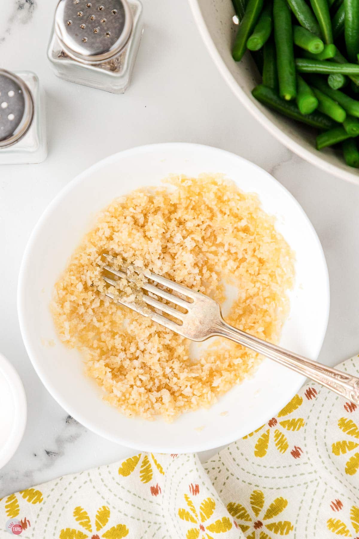 panko and butter on a plate with a fork mixing them